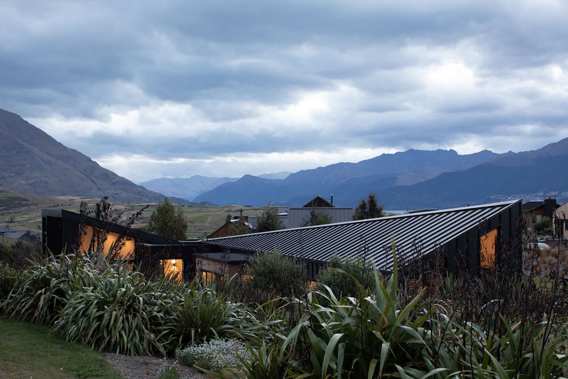 Northeast-facing elevation taken from the existing landscape mound, which is the most exposed area of the site and where there is a 'no build' line on the section.