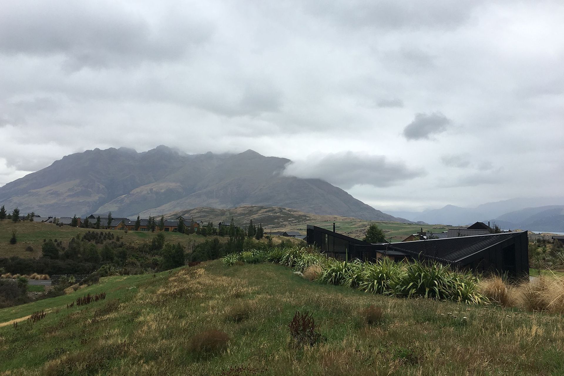 Hill House seen in context with the neighbouring houses to the west, as seen from the existing landscape mound.