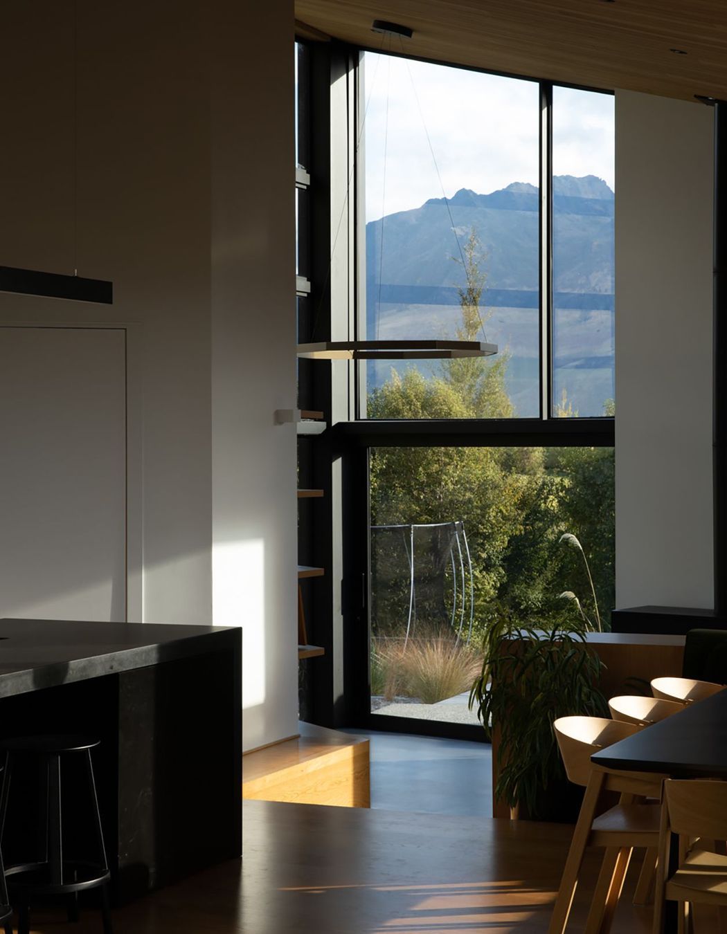 The pantry door on the left opens up with glazing to reveal a landscape view.