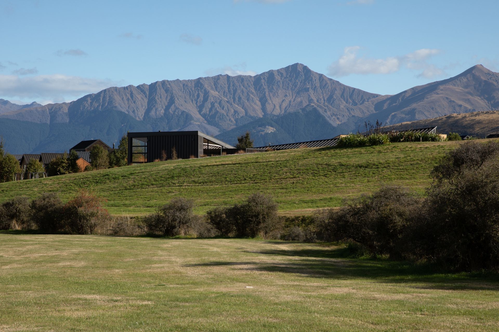 Located at the entrance of Jack's Point, Queenstown, Hill House is surrounded by mountain ranges.