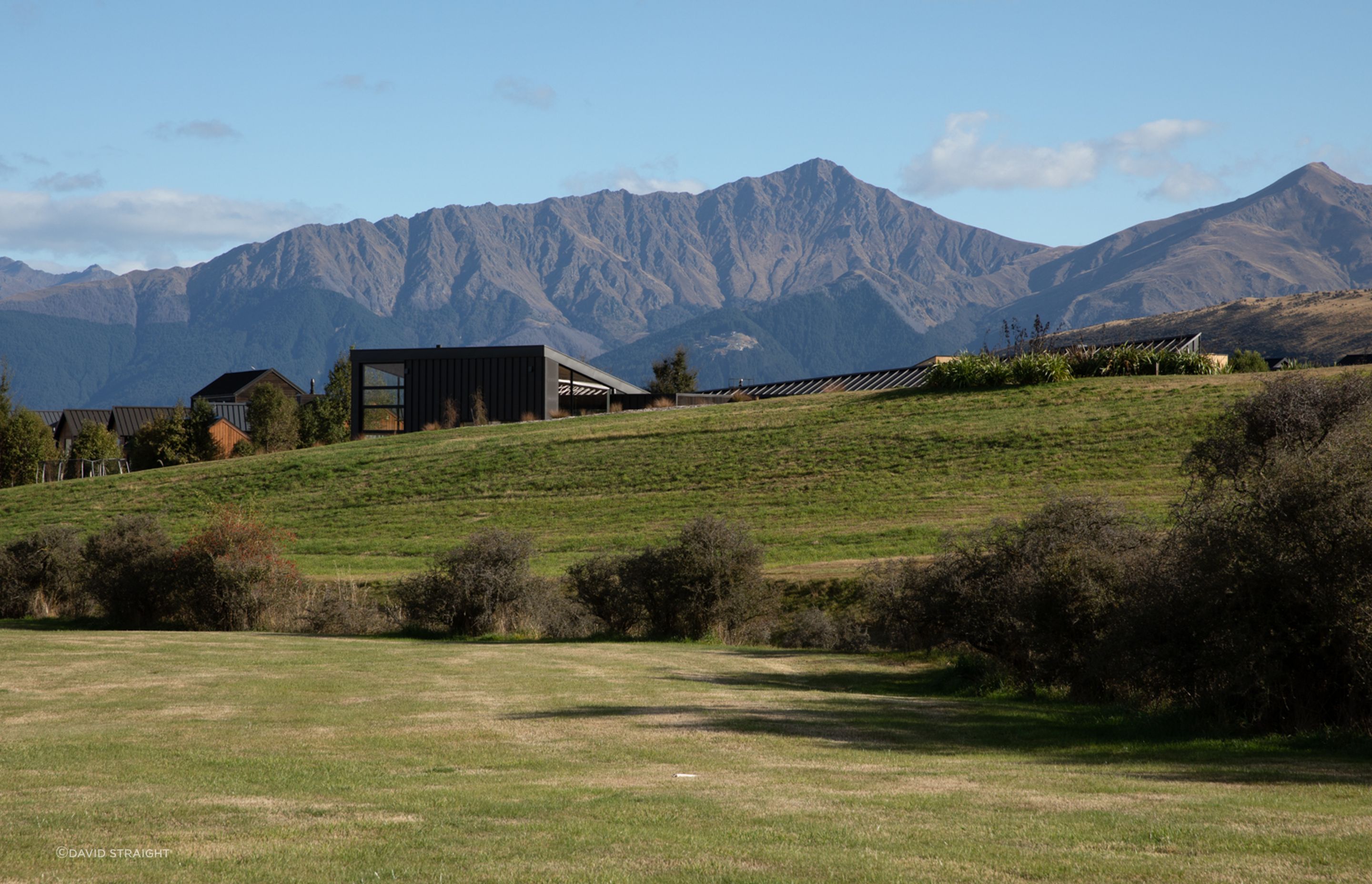 Located at the entrance of Jack's Point, Queenstown, Hill House is surrounded by mountain ranges.