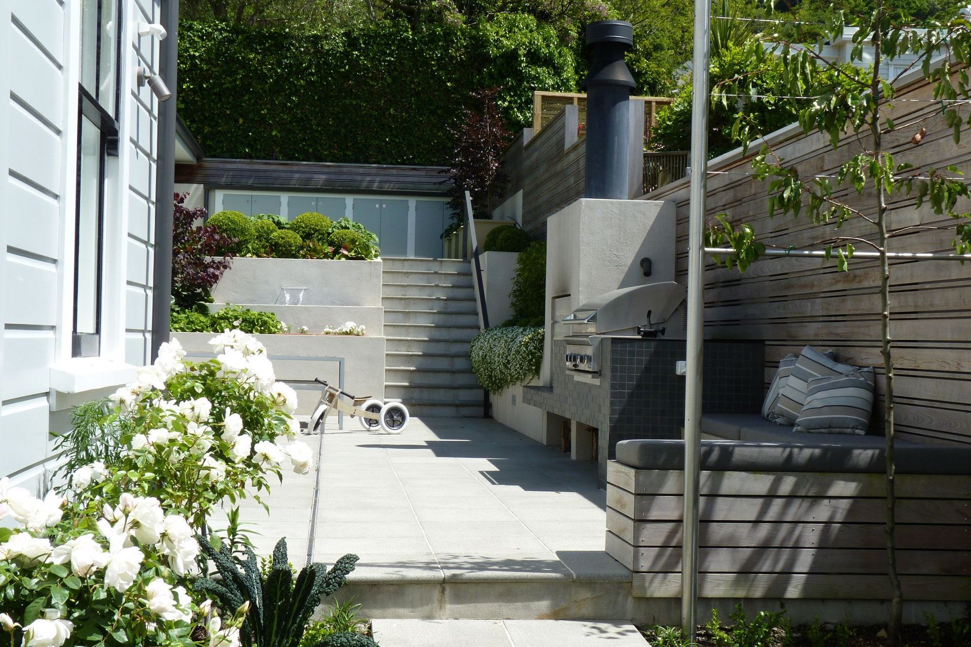 Sunny sheltered private back garden. Architecture &amp; associated landscape architecture by Tse : Wallace Architects.