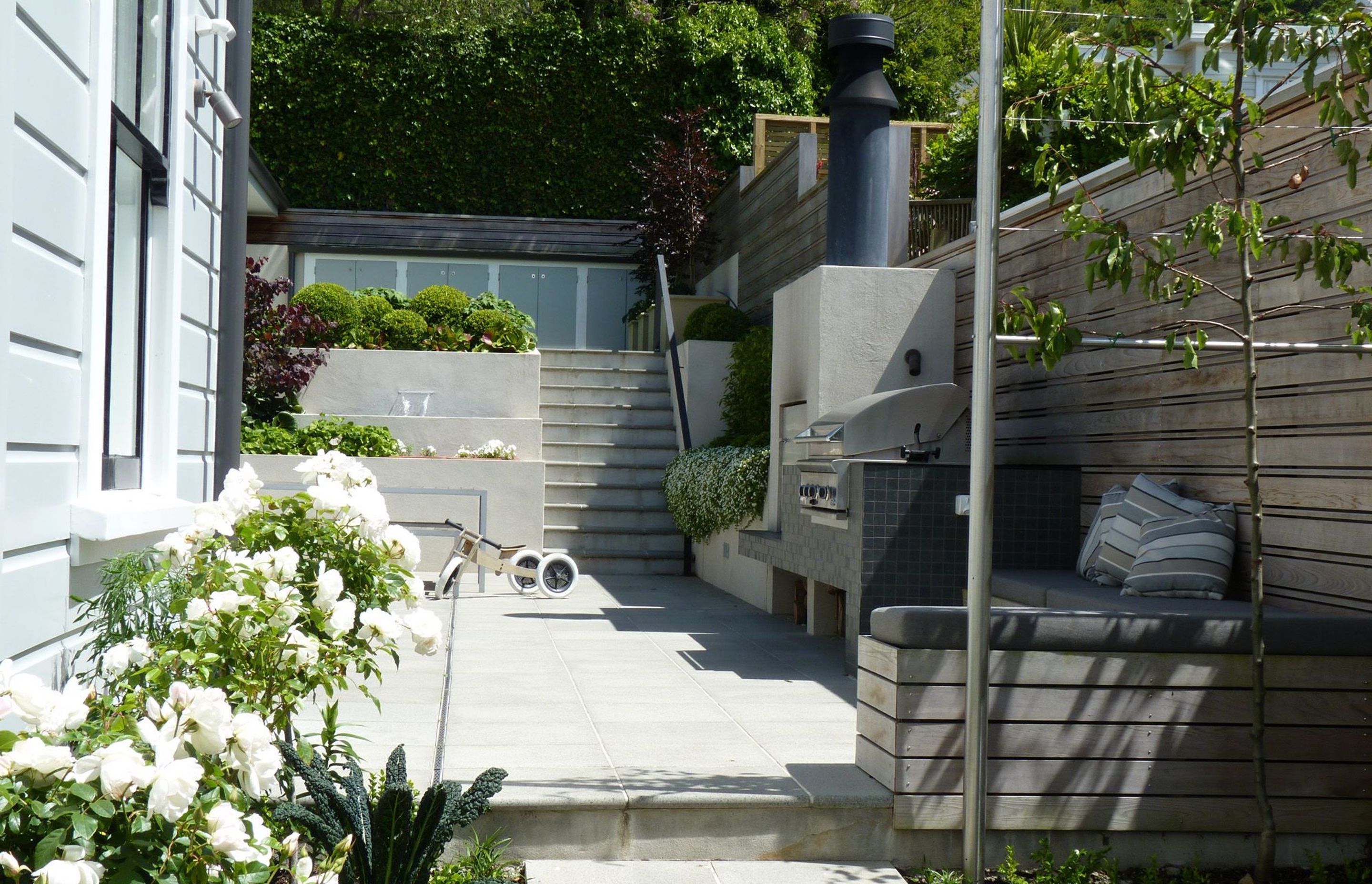 Sunny sheltered private back garden. Architecture &amp; associated landscape architecture by Tse : Wallace Architects.