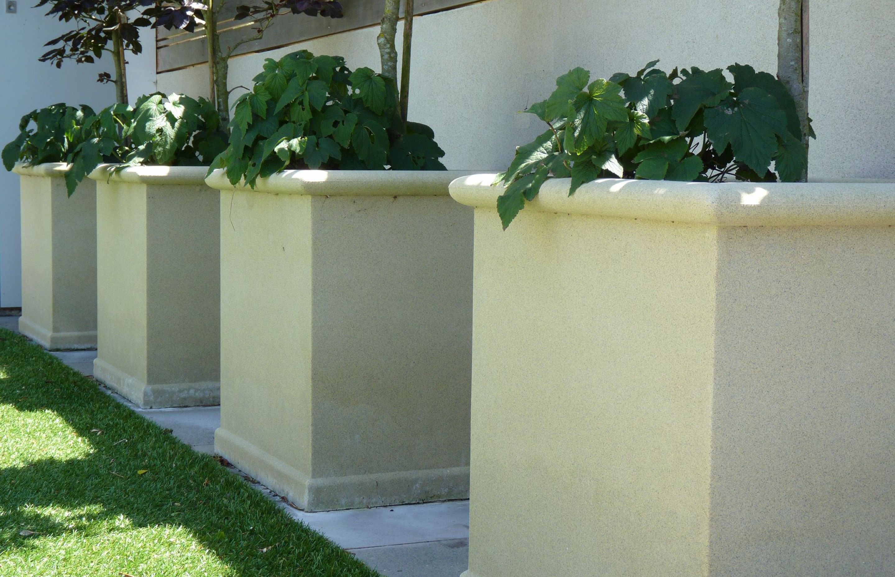 Sanstone square concrete pots were craned on site