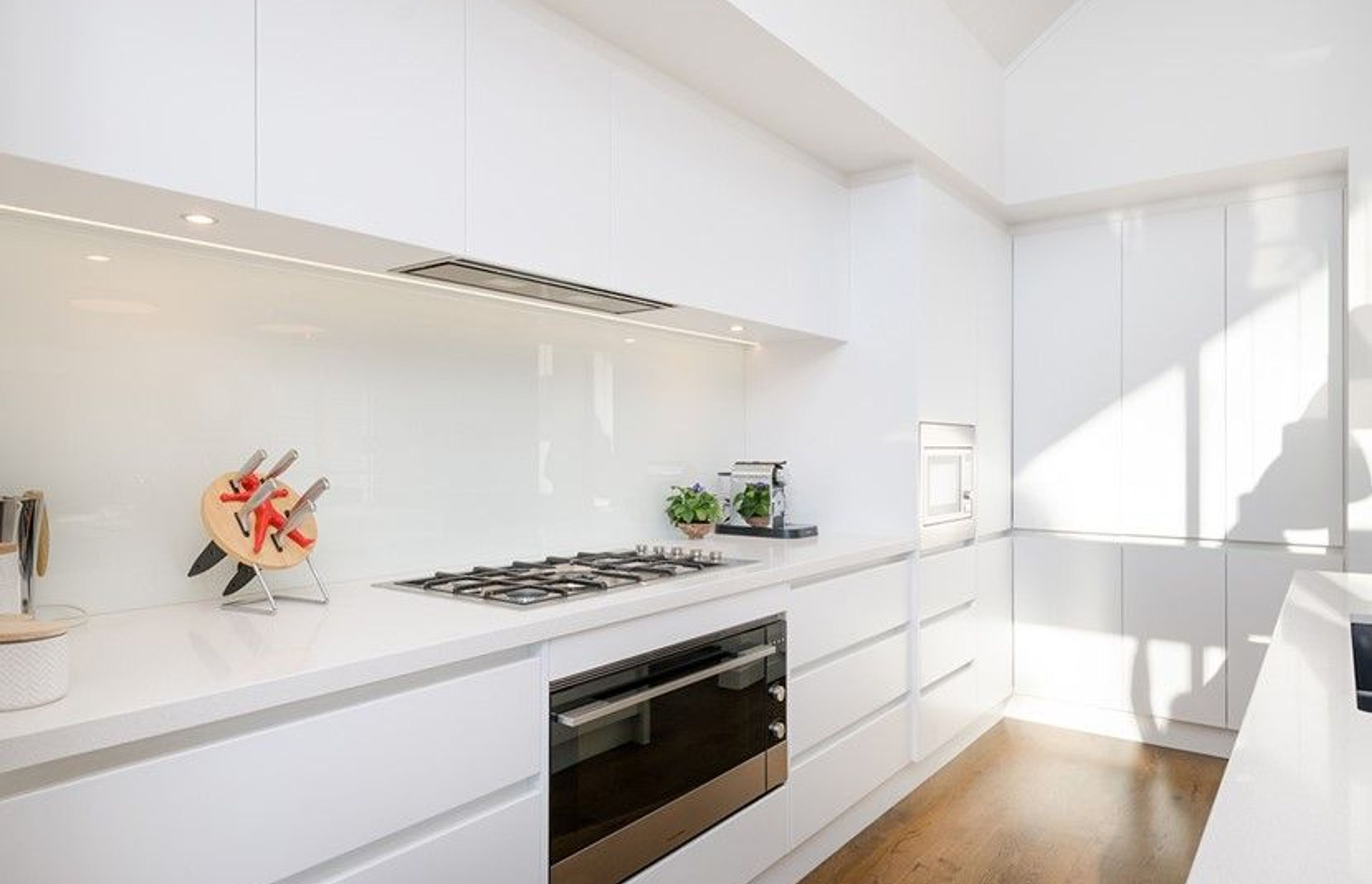 Hobsonville House I - Solid American White Oak Flooring finished w/ Stain in 'Antique Brown' and waterborne polyurethane