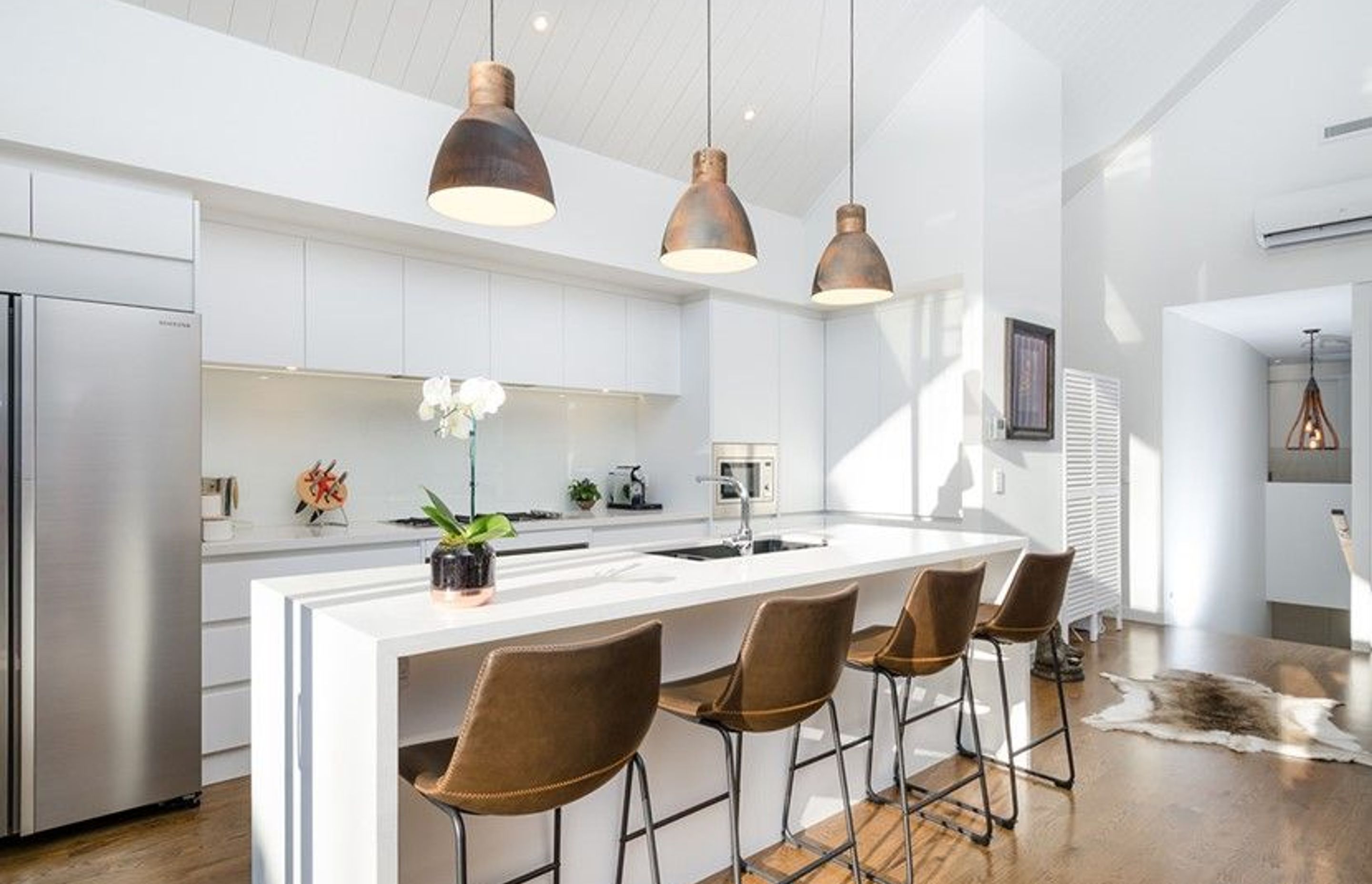 Hobsonville House I - Solid American White Oak Flooring finished w/ Stain in 'Antique Brown' and waterborne polyurethane