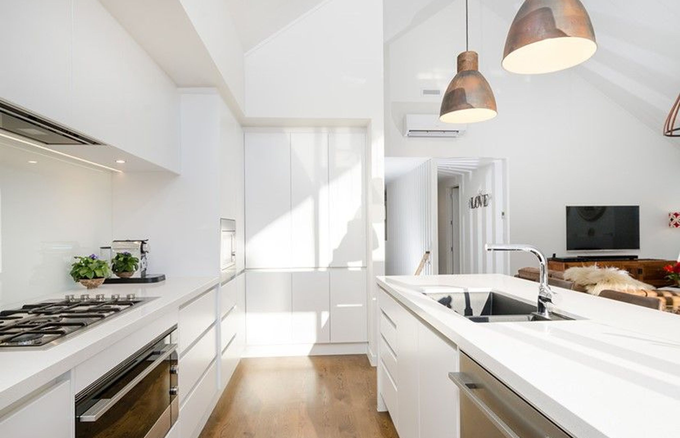 Hobsonville House I - Solid American White Oak Flooring finished w/ Stain in 'Antique Brown' and waterborne polyurethane