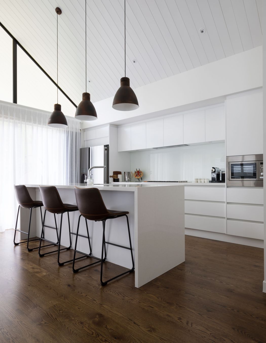 Hobsonville House I - Solid American White Oak Flooring finished w/ Stain in 'Antique Brown' and waterborne polyurethane