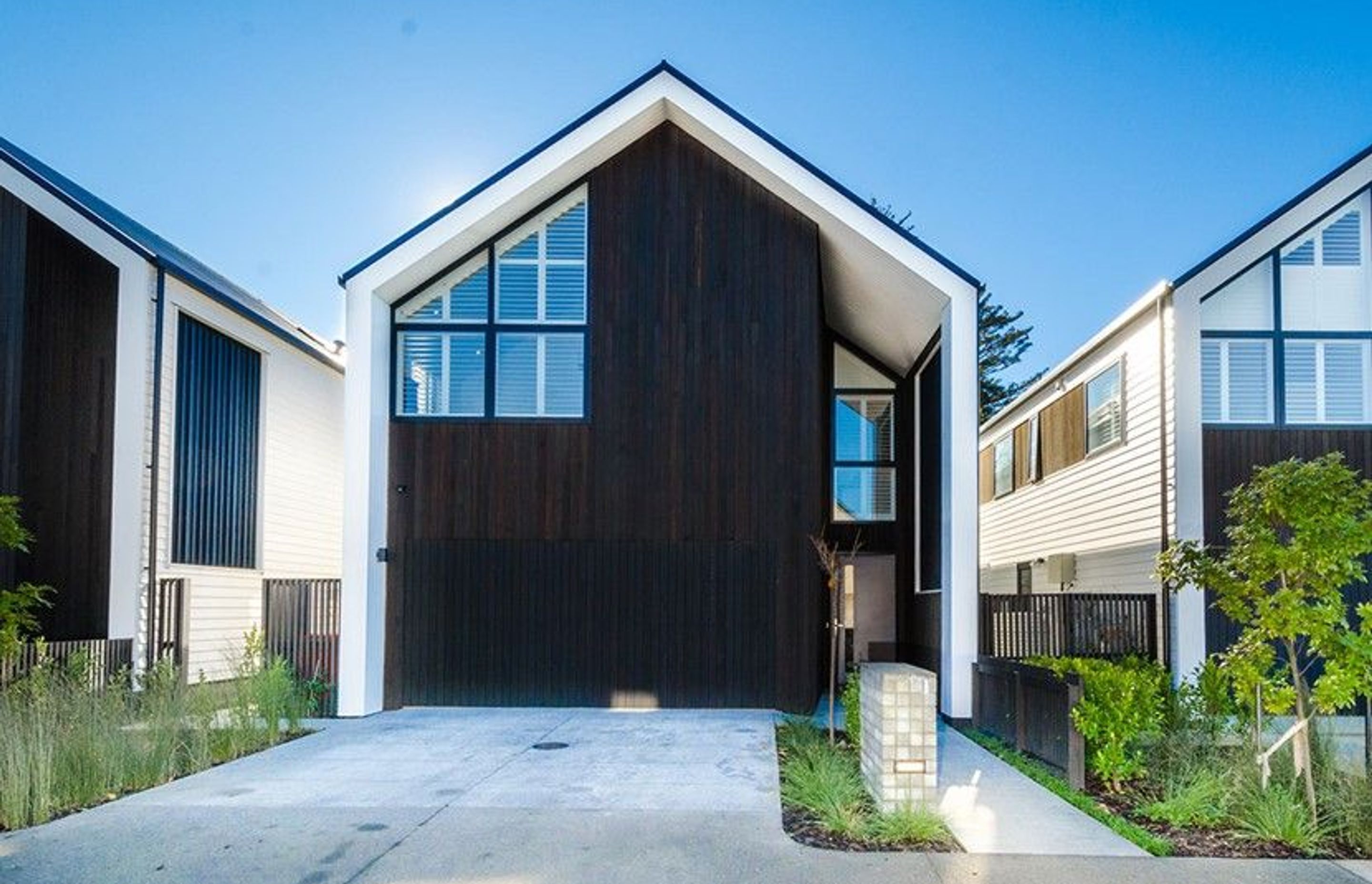 Hobsonville House I - Solid American White Oak Flooring finished w/ Stain in 'Antique Brown' and waterborne polyurethane