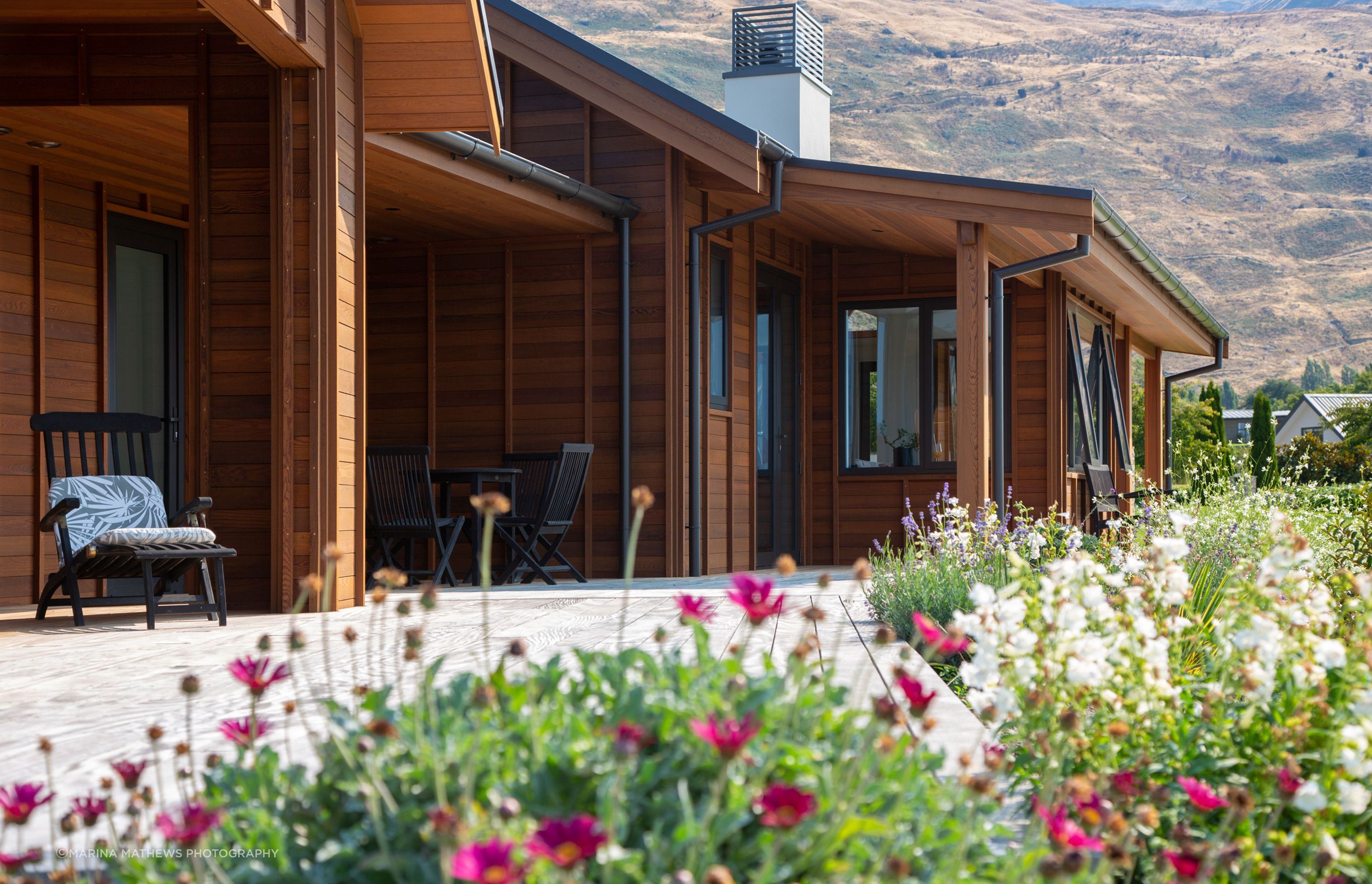 An east-facing deck and courtyard is bathed in sunlight making it an ideal spot for relaxing outdoors.