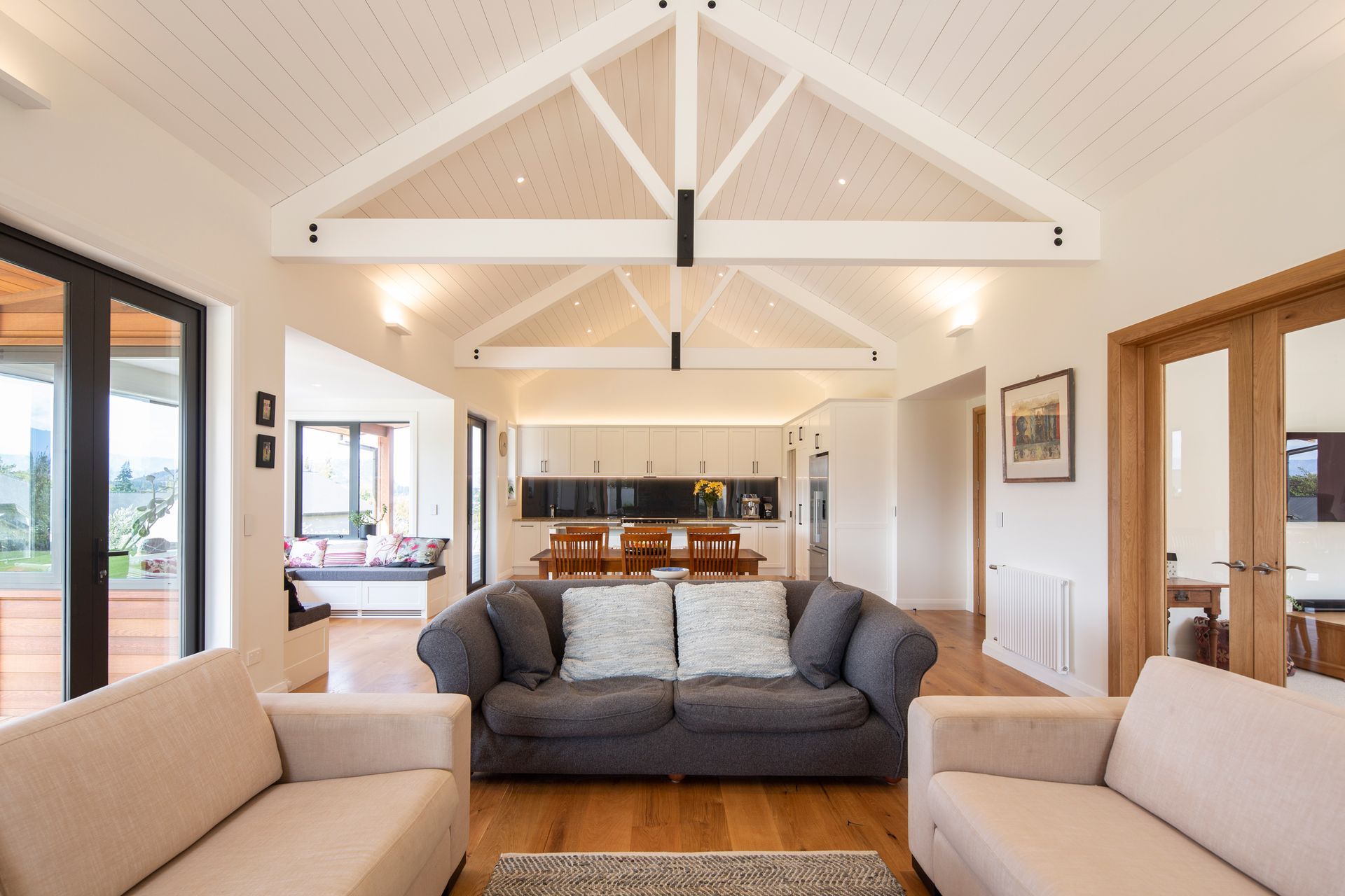 Off the living area are a number of outdoor entertaining spaces, while a smaller, contained family room can be closed off for a sense of separation when needed.