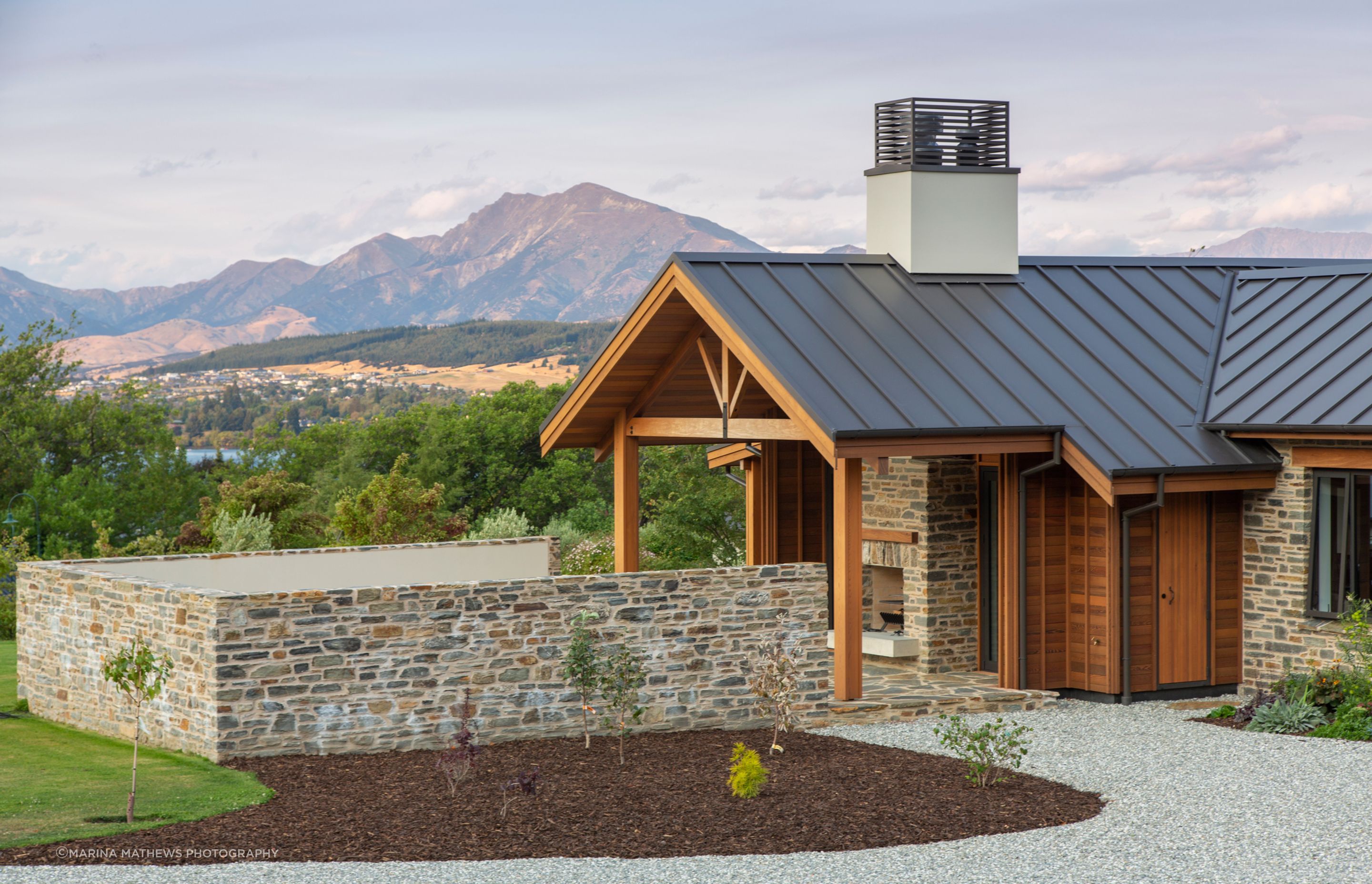 A walled courtyard with open fireplace is another of the outdoor areas.