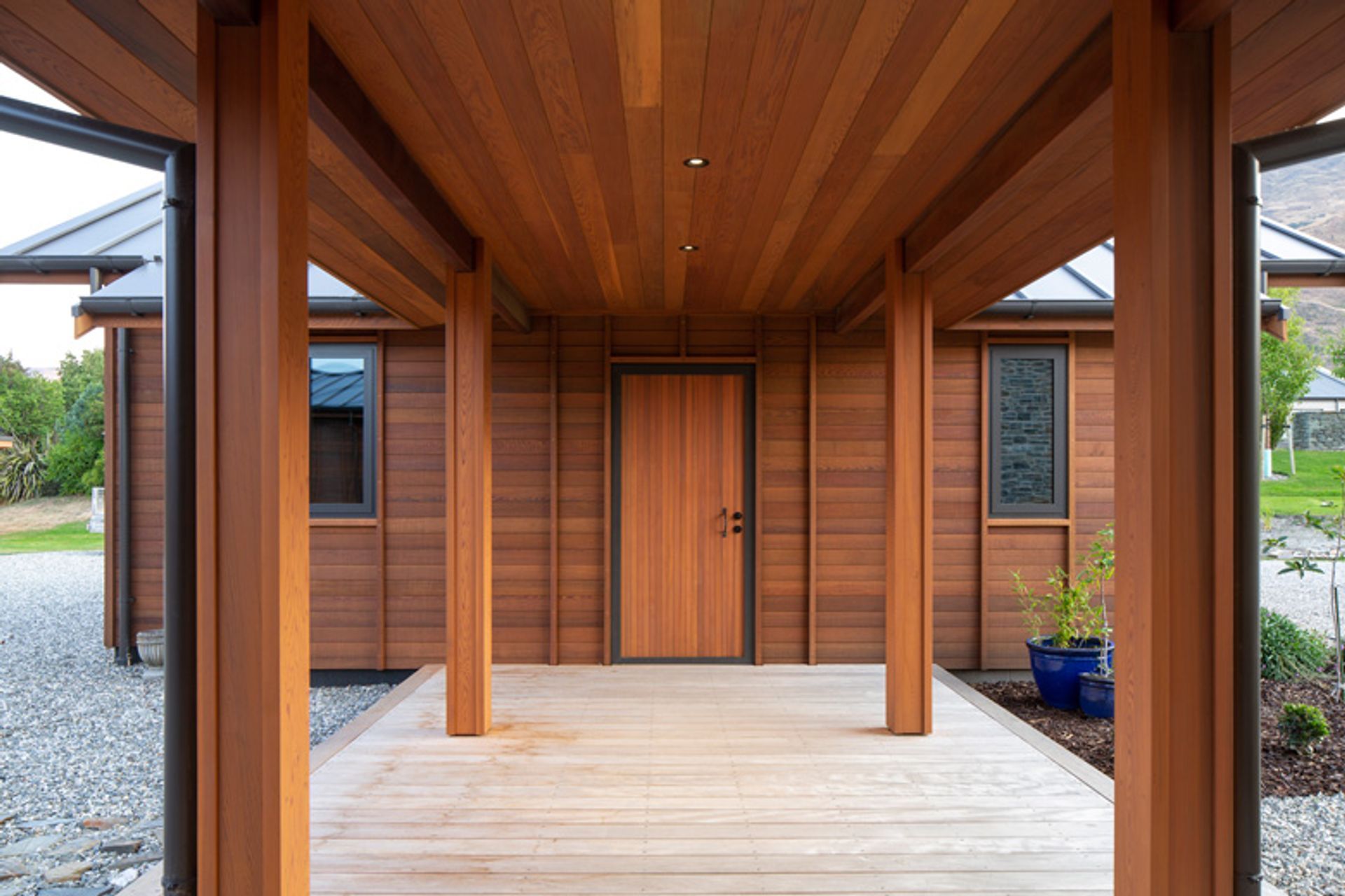 A covered walkway links the separate garage, with mudroom facilities, to the main house.