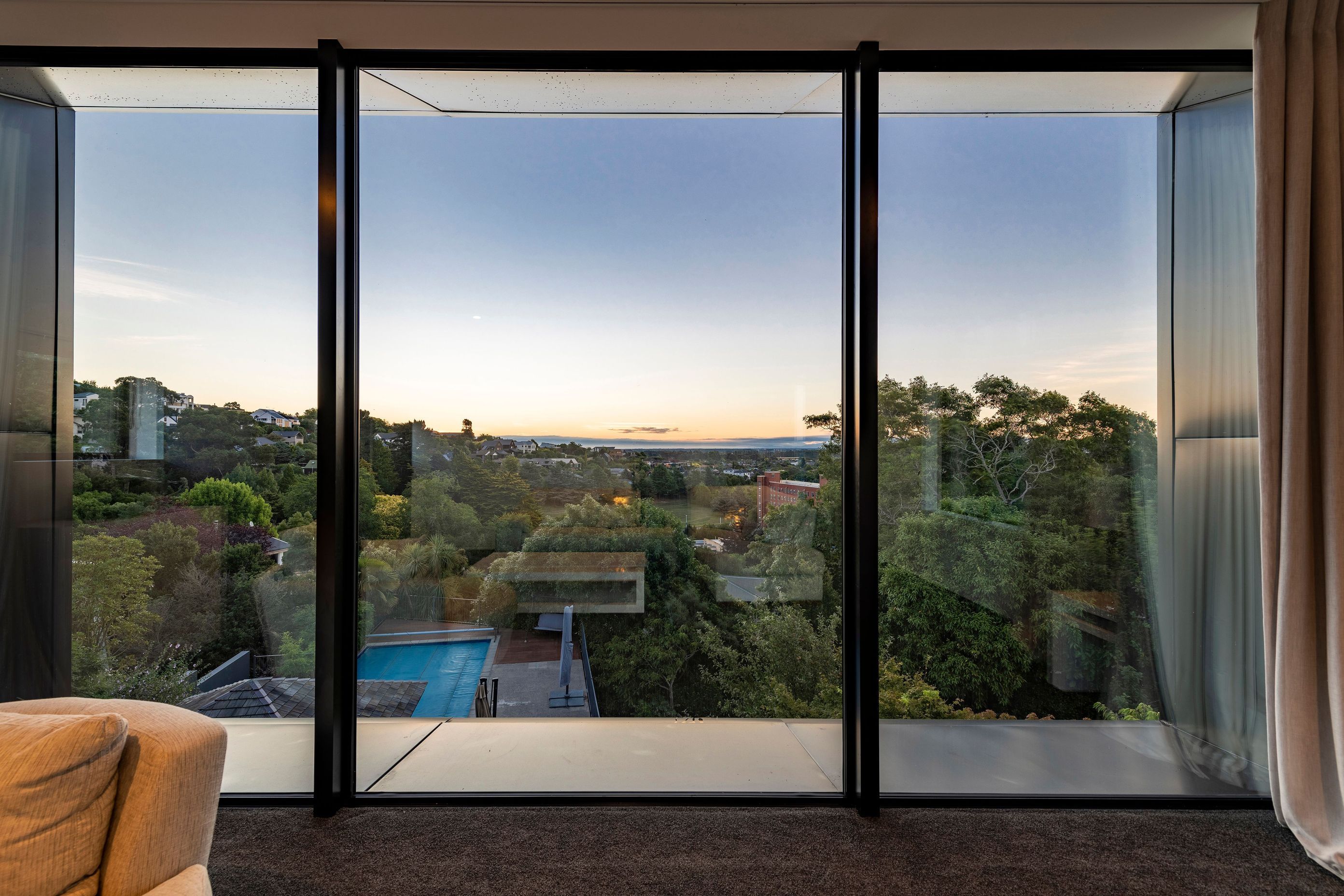 A glimpse of the sunset and the existing pool and cabana from the lounge area.