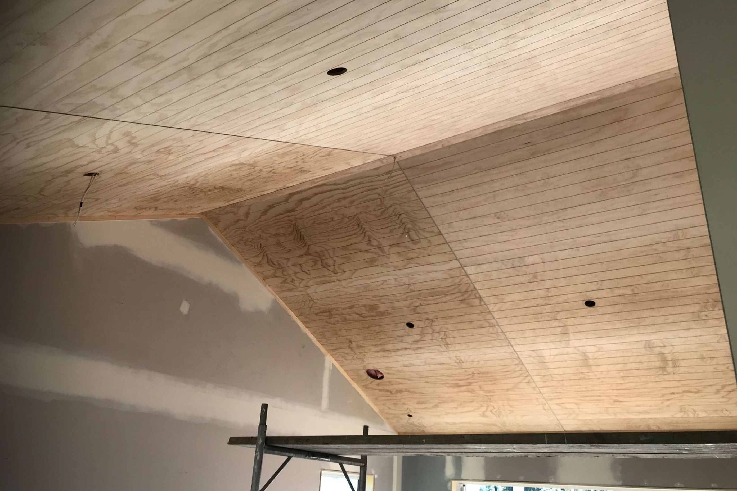 Pitched V-Groove Ply Ceiling prior to painting.