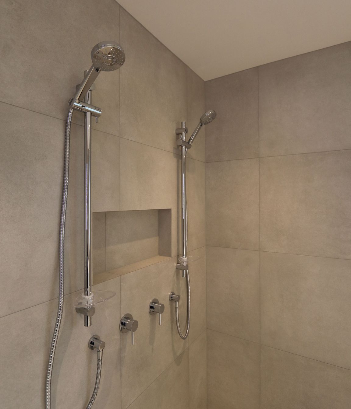 Large double shower in the main bathroom with a discreet channel drain.