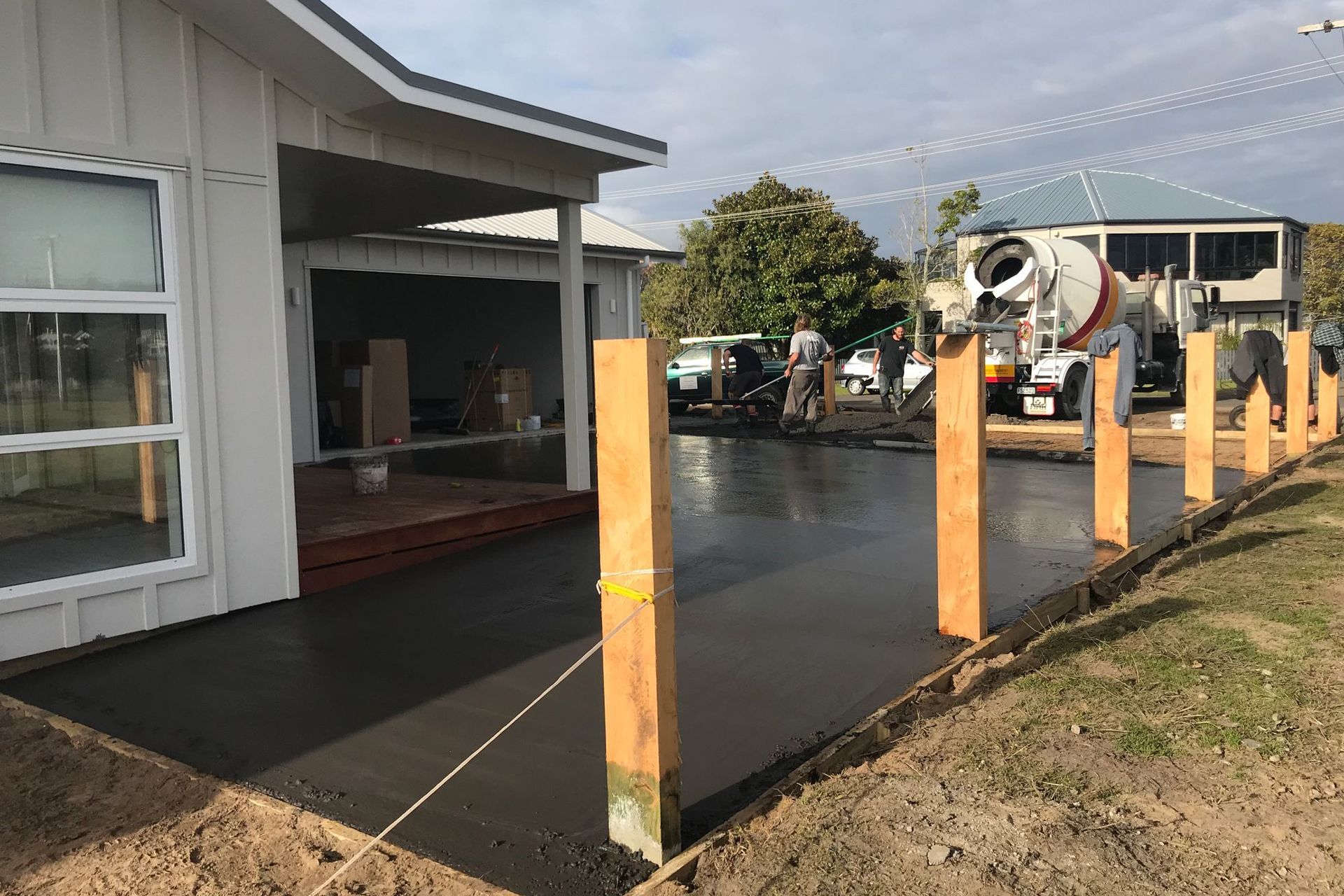 The important last steps with the exposed aggregate driveway being poured.