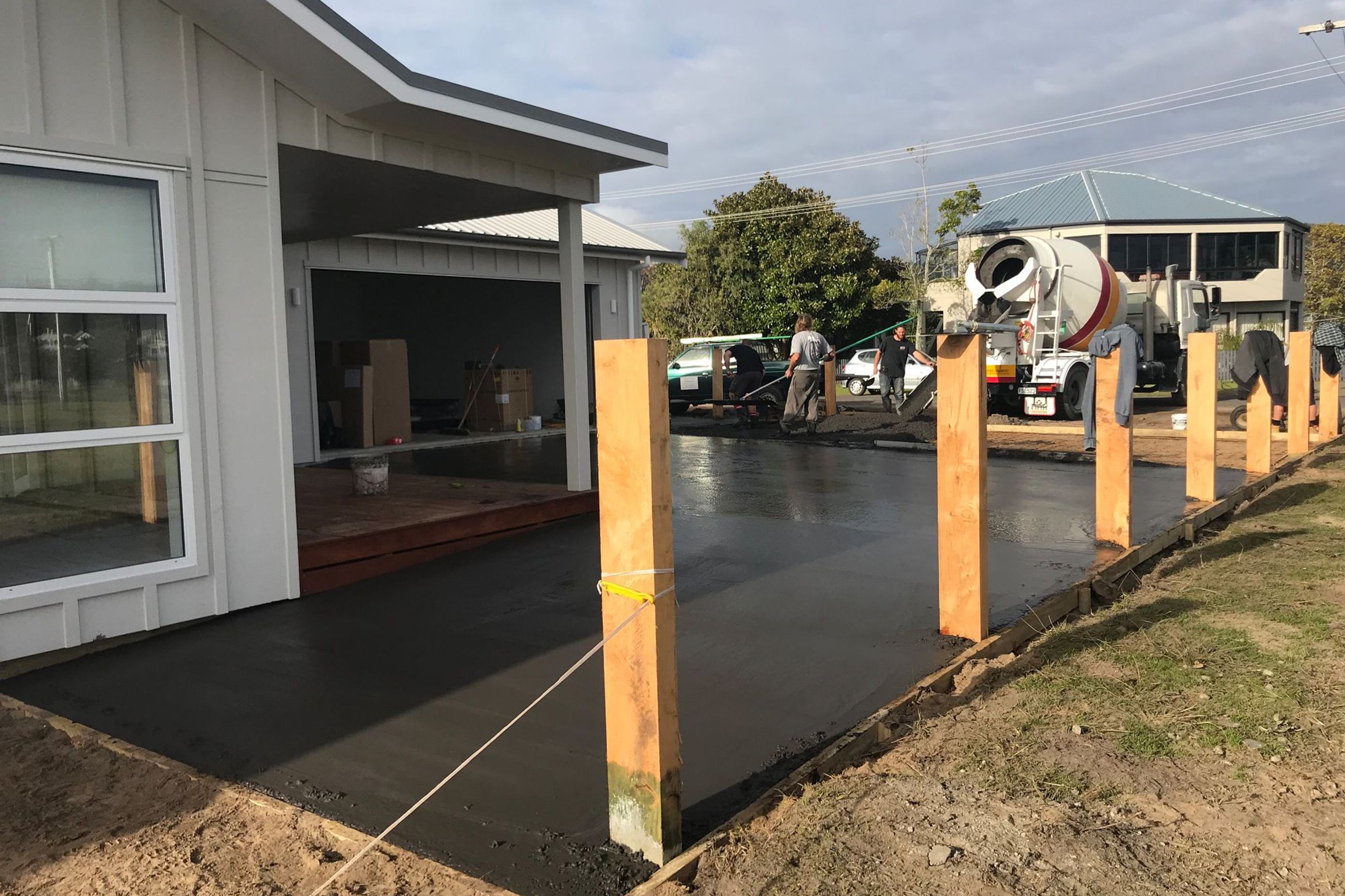 The important last steps with the exposed aggregate driveway being poured.