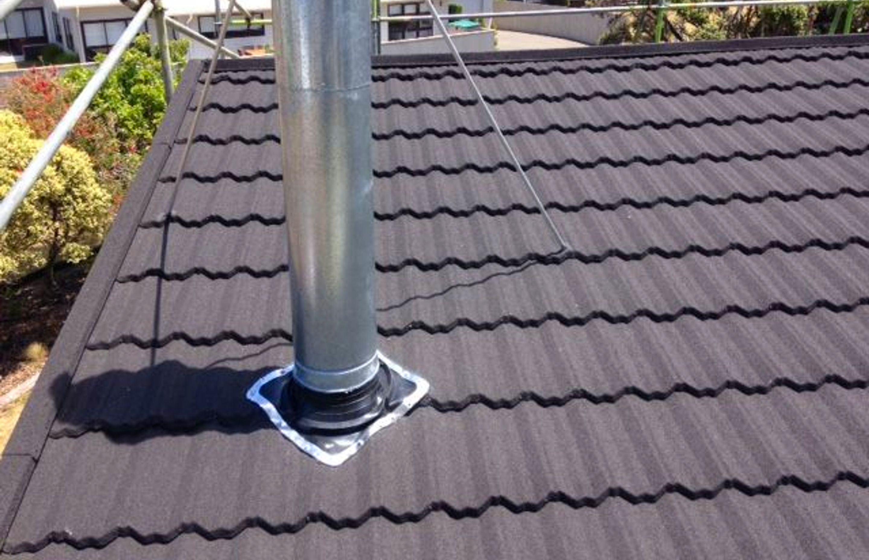 Dektite flexible flashings are an essential way to flash and seal pipe penetrations through most roof sheet profiles.