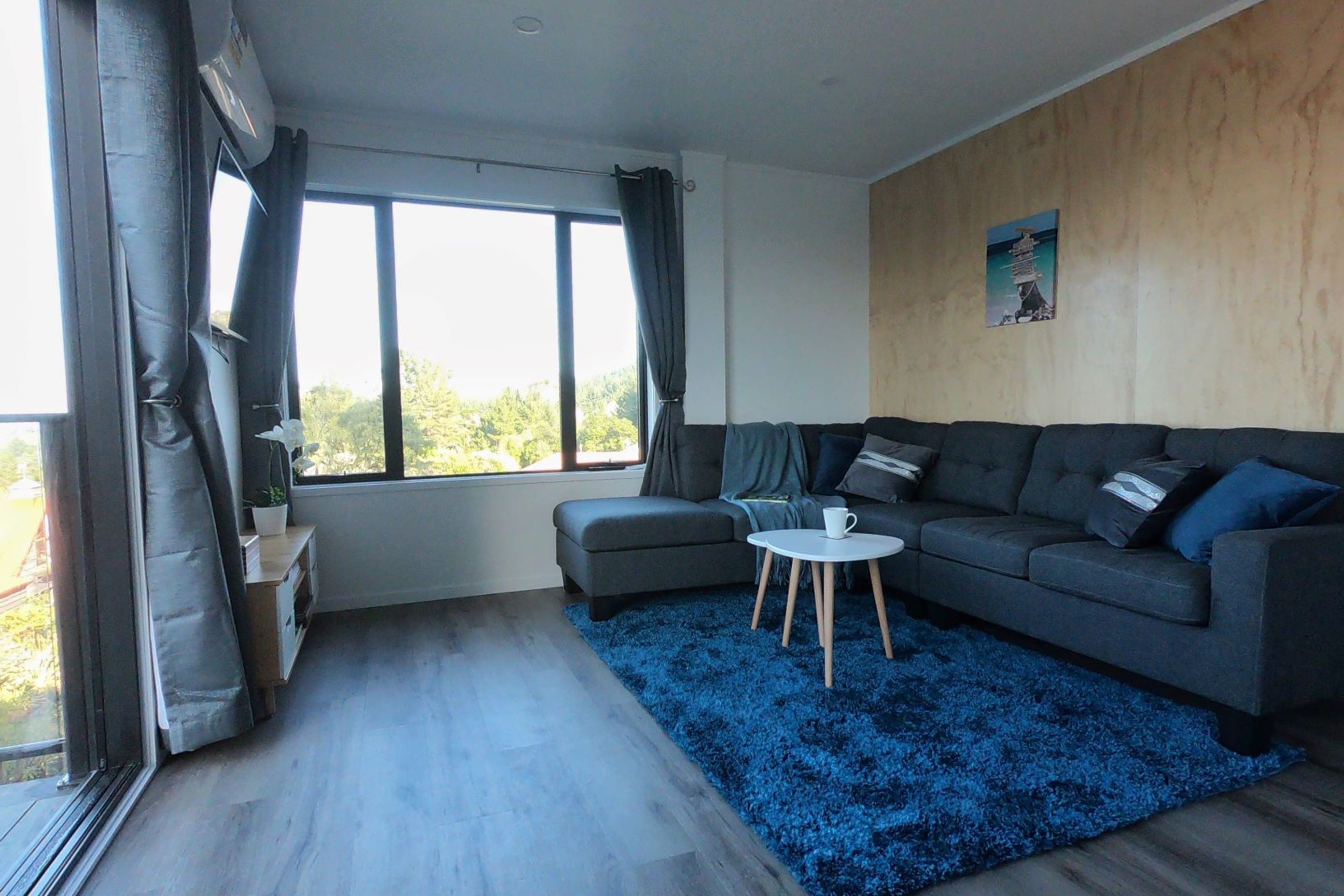 Living room spanning the width of 1.5 containers