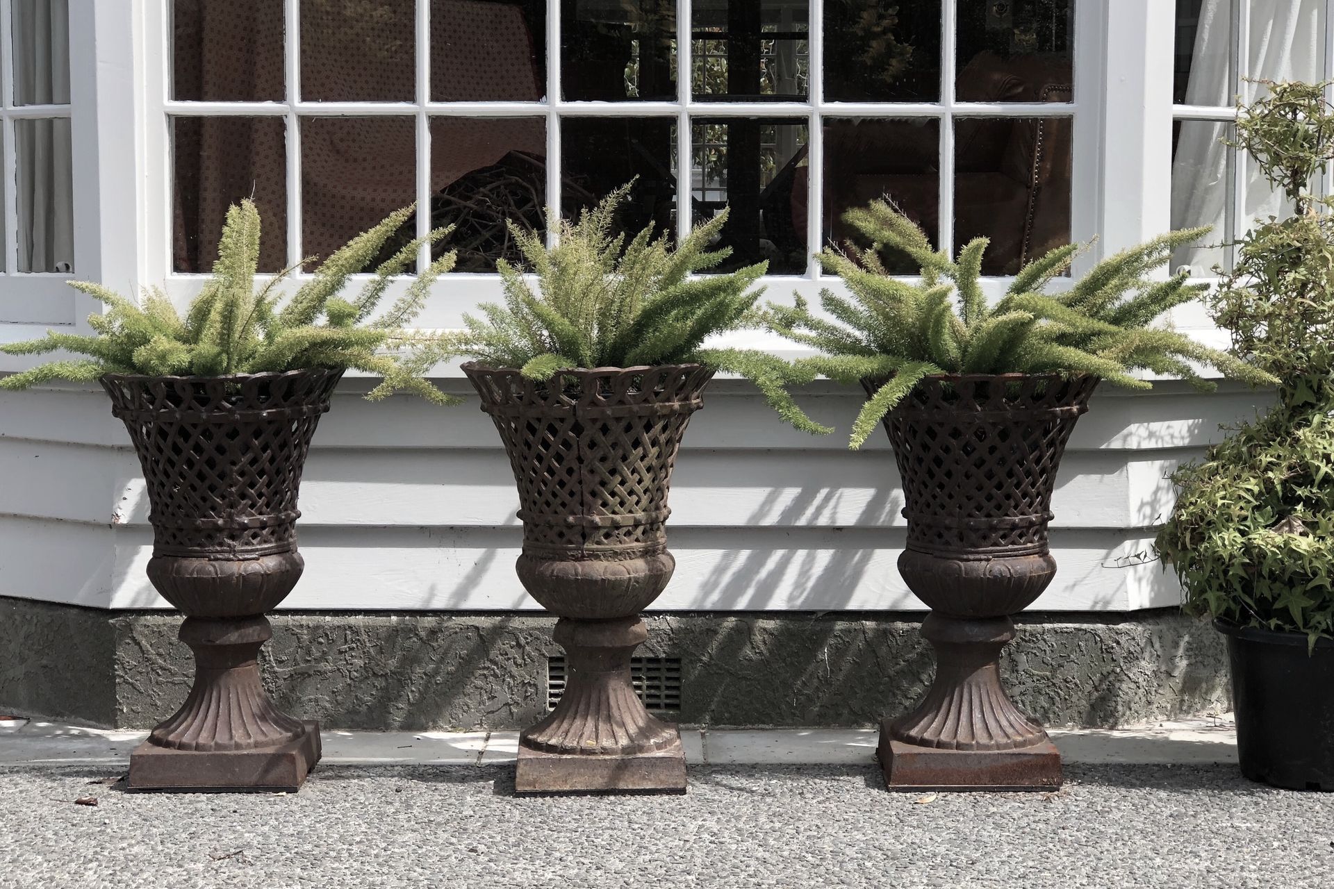 French lattice cast iron urns