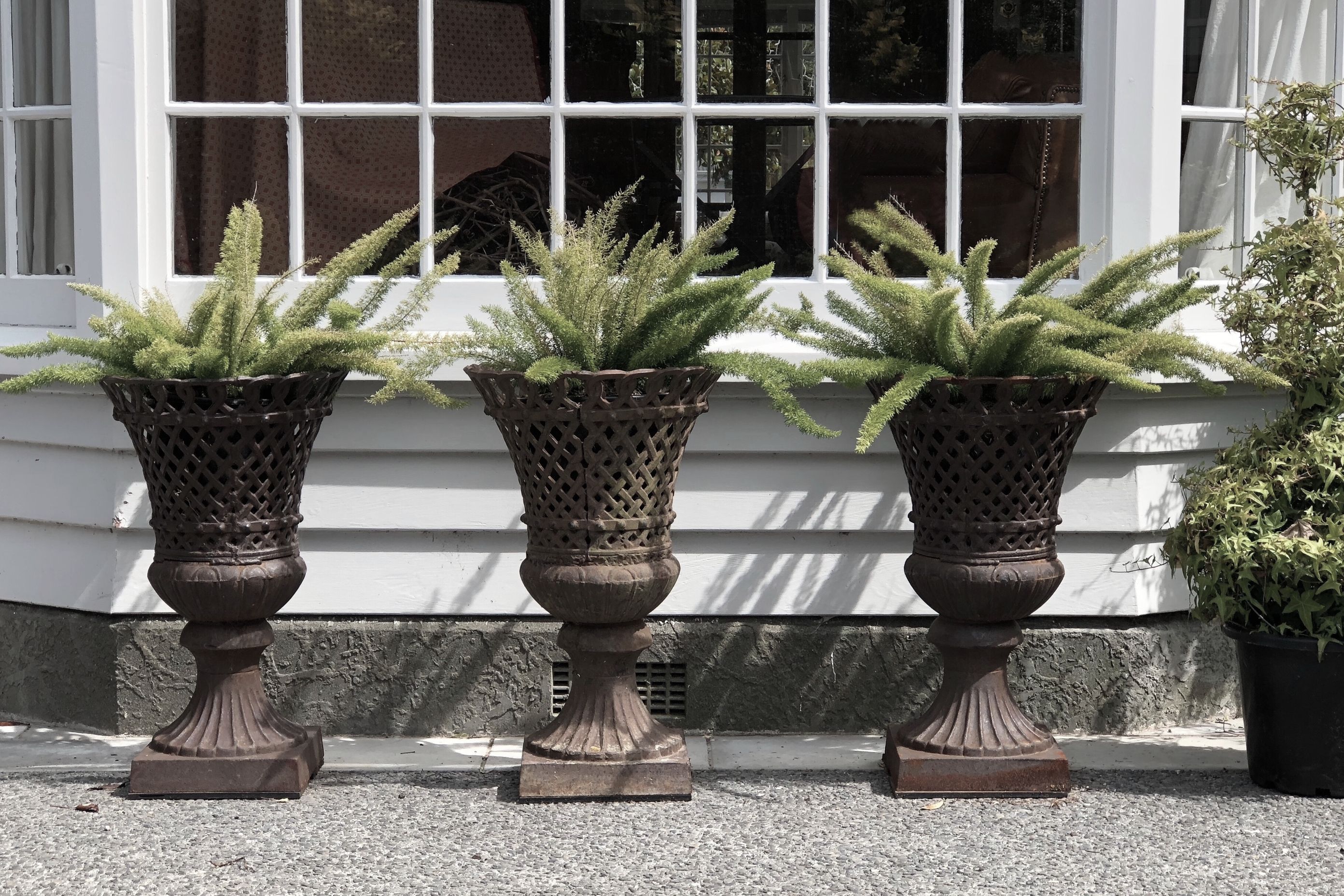 French lattice cast iron urns