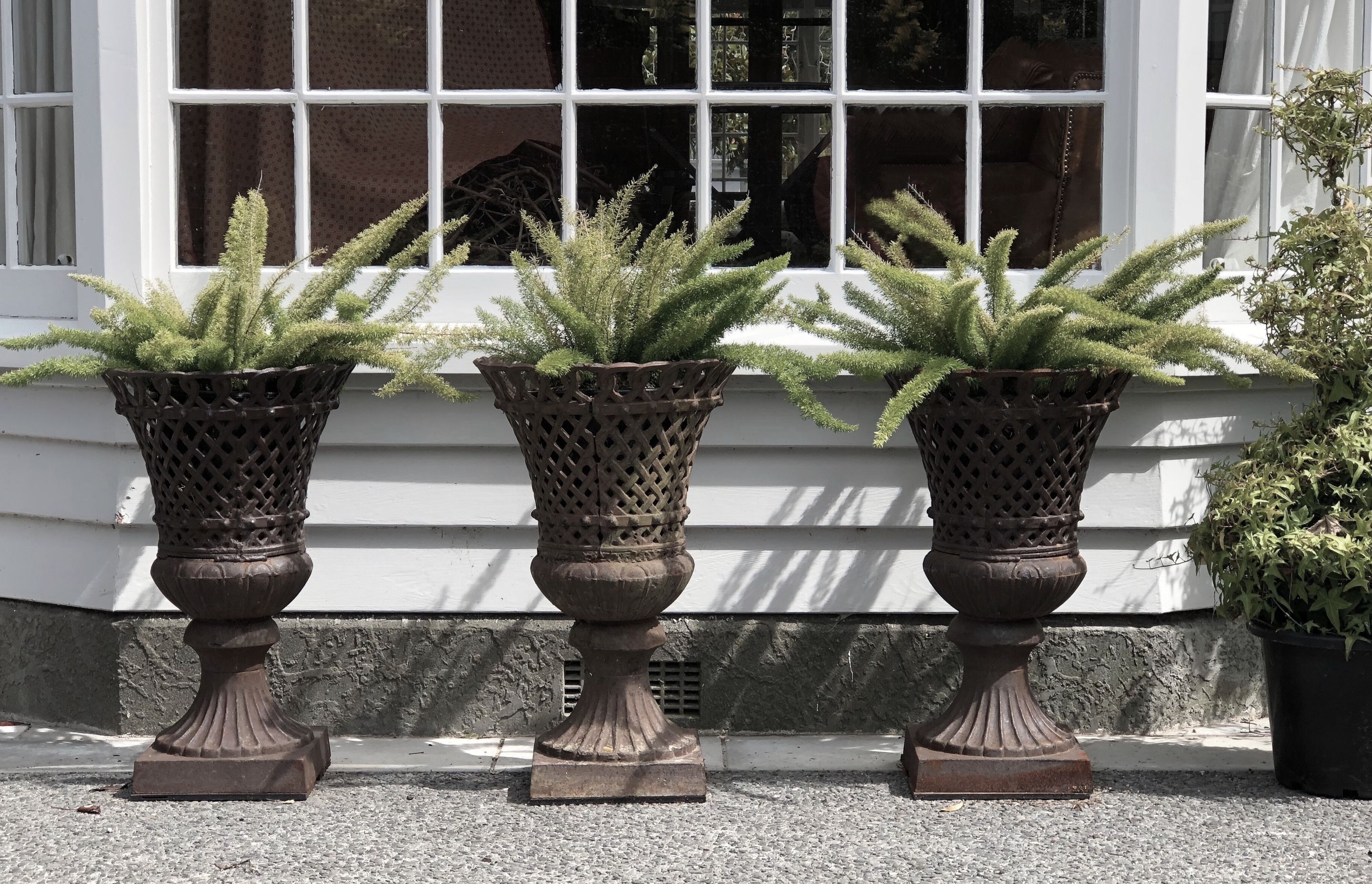 French lattice cast iron urns