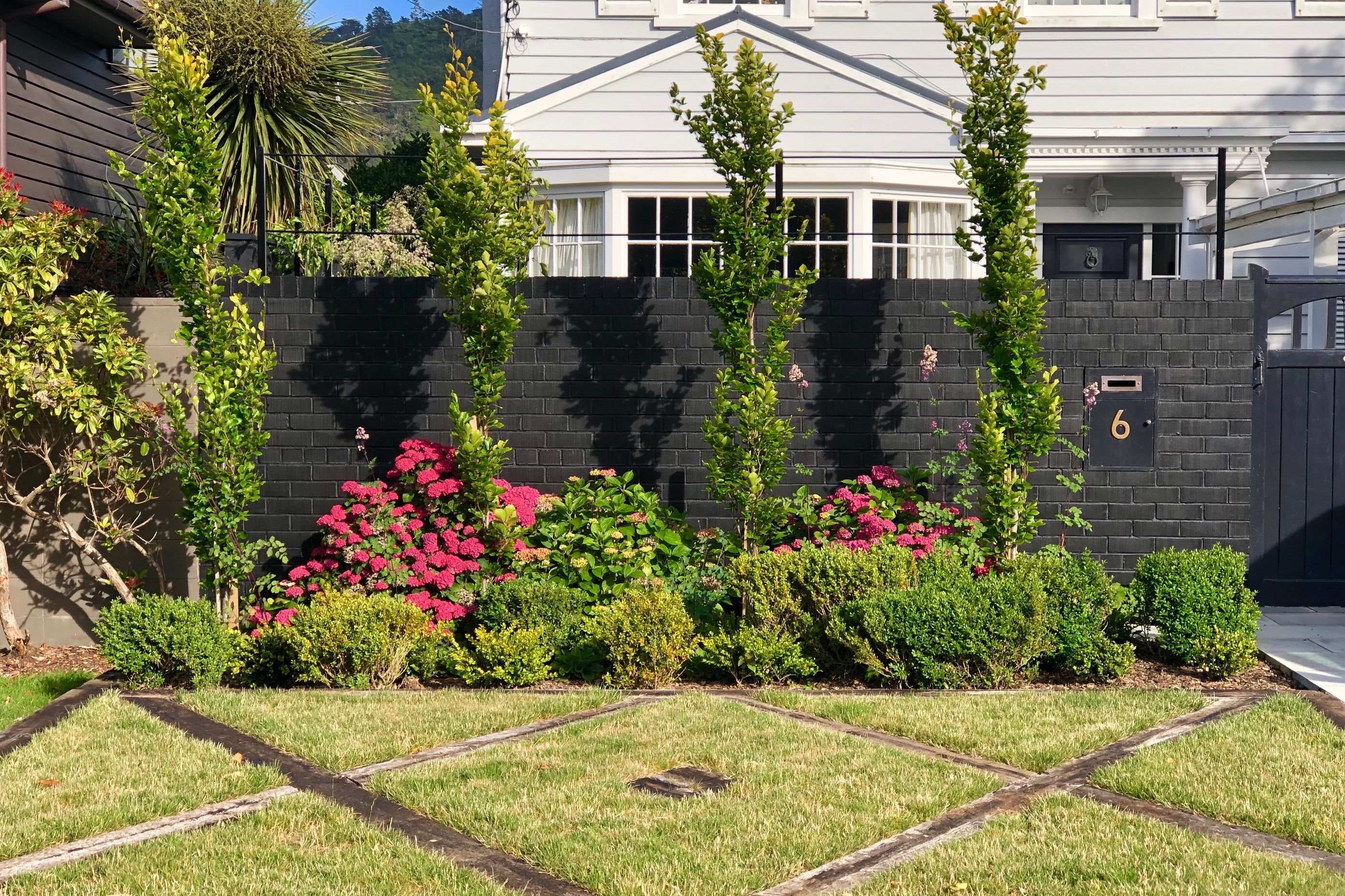 Street view of 6 Izard Rd &amp; the new railway sleeper parterre