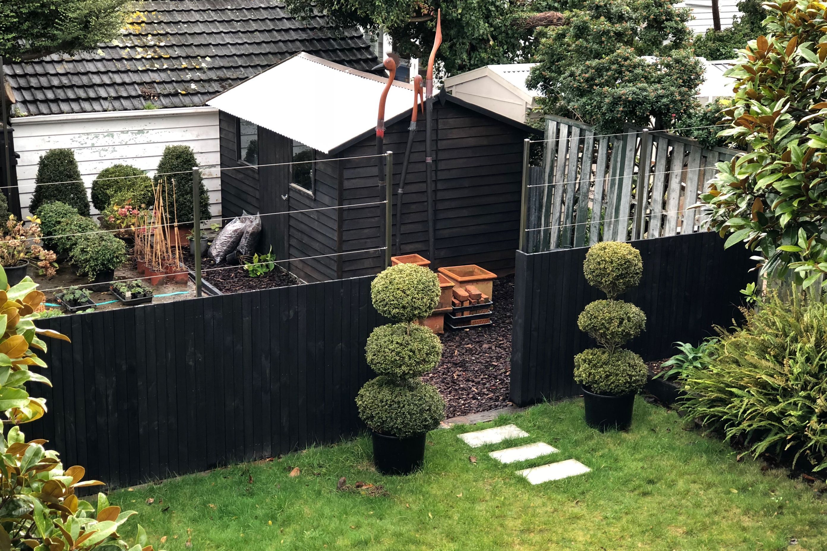 View to the lawn and the entrance to the small plant nursery