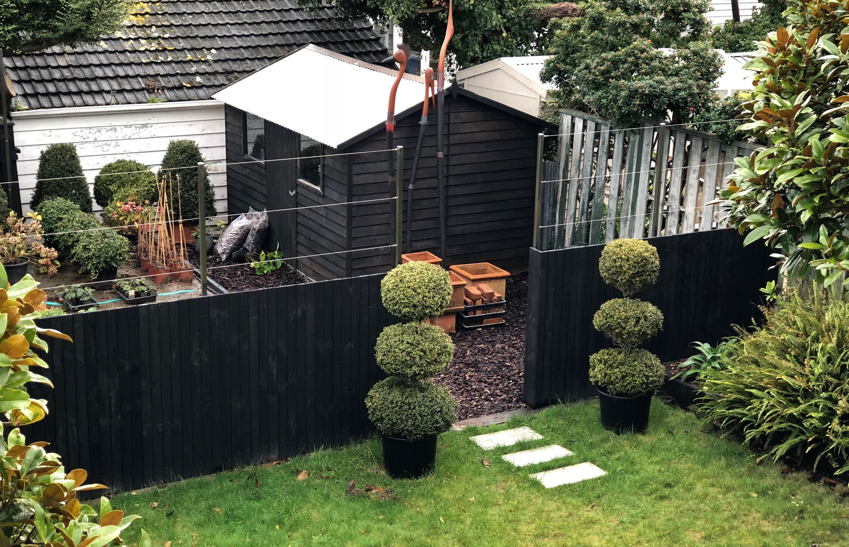 View to the lawn and the entrance to the small plant nursery