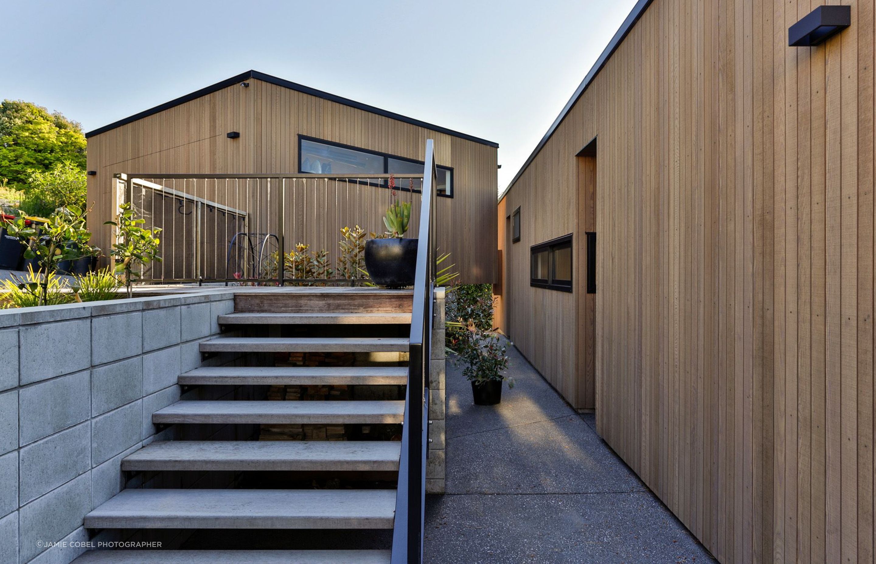 The courtyard by the front door will eventually have plants growing up the blockwork retaining walls and balustrades.