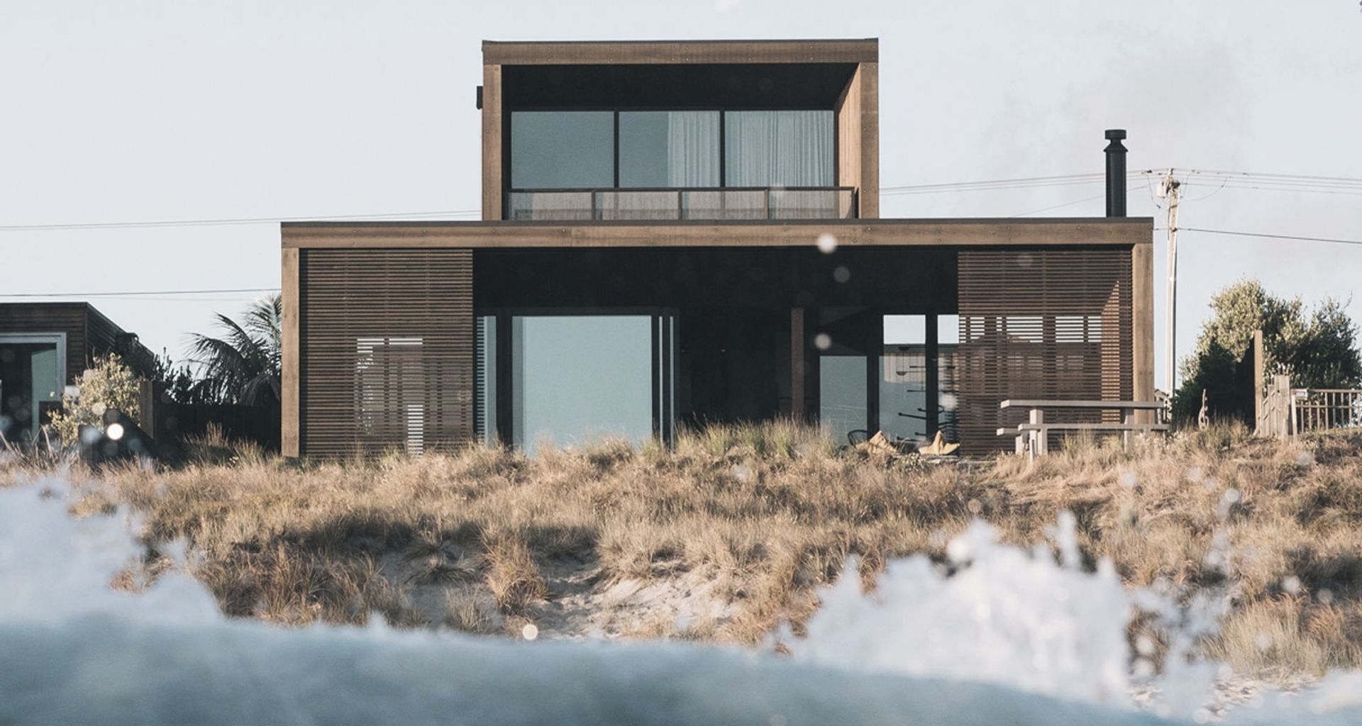 Sitting within the dunes on Papamoa Beach, Tauranga, this home is as close to beachfront as you can get. 