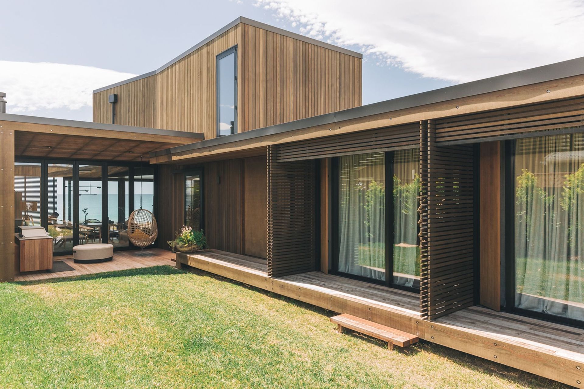 The central courtyard links each of the bedrooms on the ground floor with the entertaining area and beachfront beyond. 