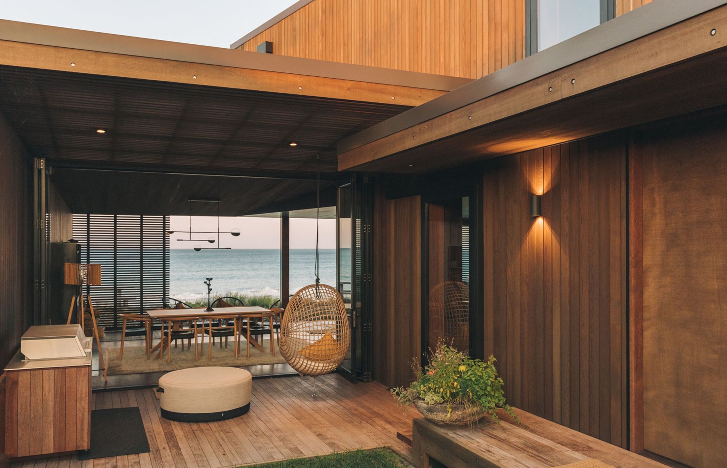 A concealed interior courtyard frames views of the ocean and provides a sheltered outdoor space for entertaining.