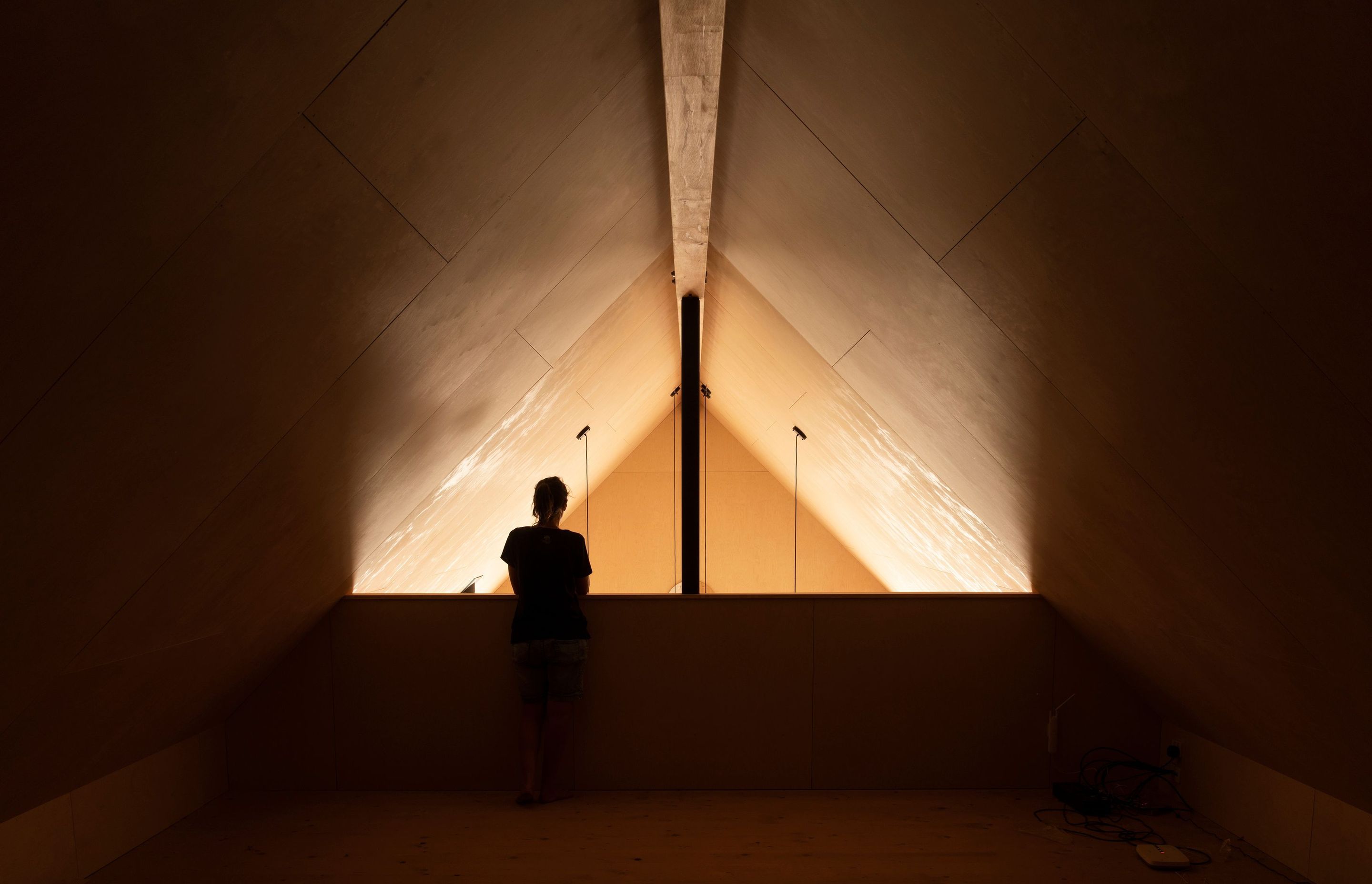 The family are bilingual and wanted a versatile ‘marae-style area that could be used for guests to sleep, as a study or a play space; seen here in the mezzanine level.