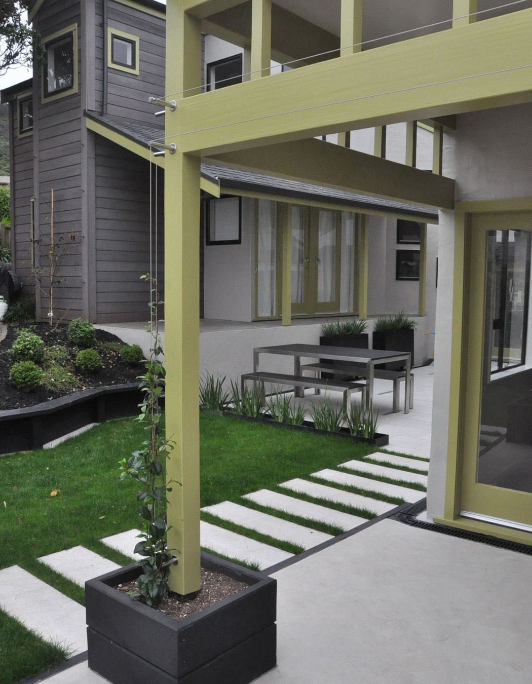 Timber planter box with wires for jasmine to train up the pole