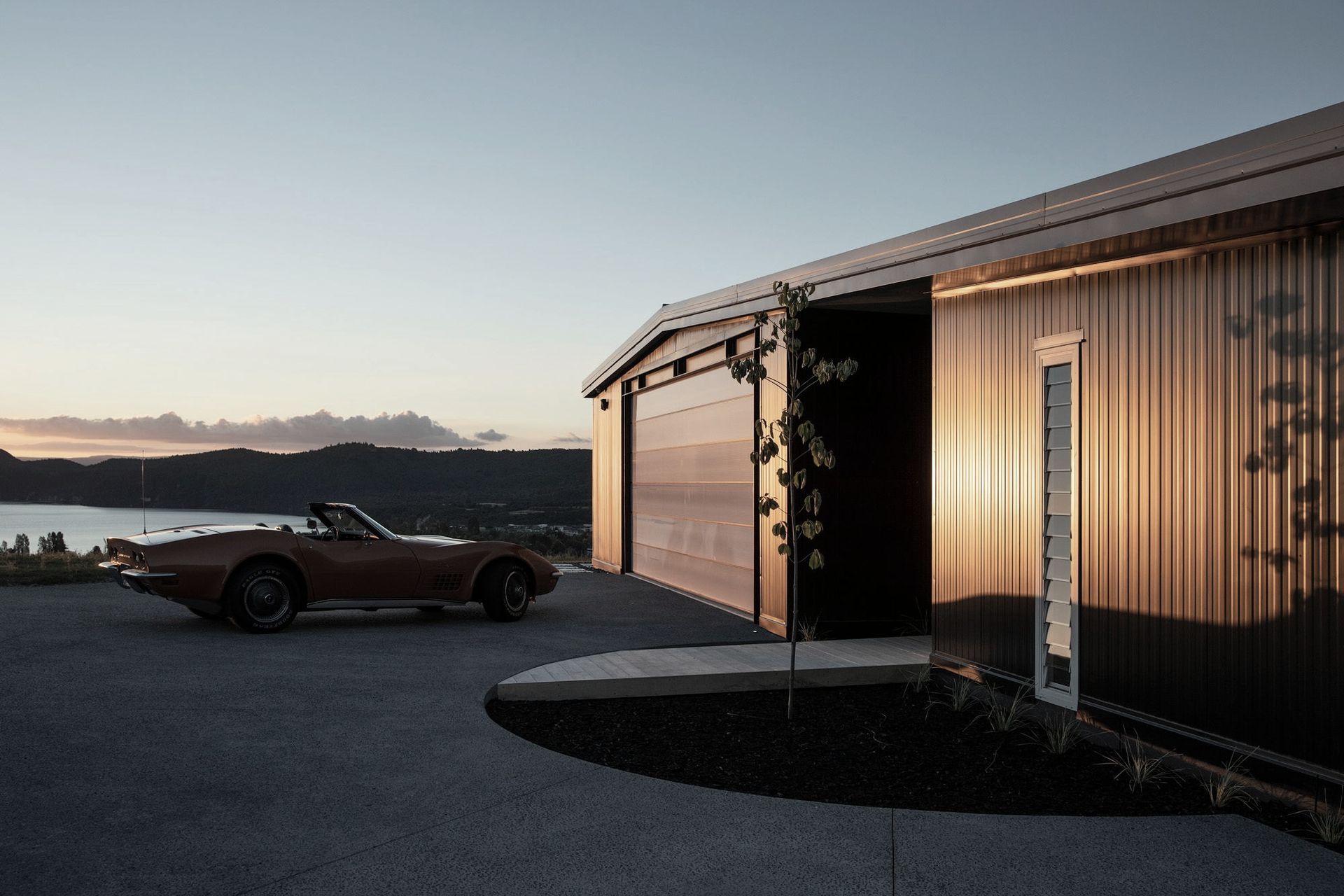 The owners' 1974 Corvette Stingray sits in front of the garage. Photograph: Simon Devitt.