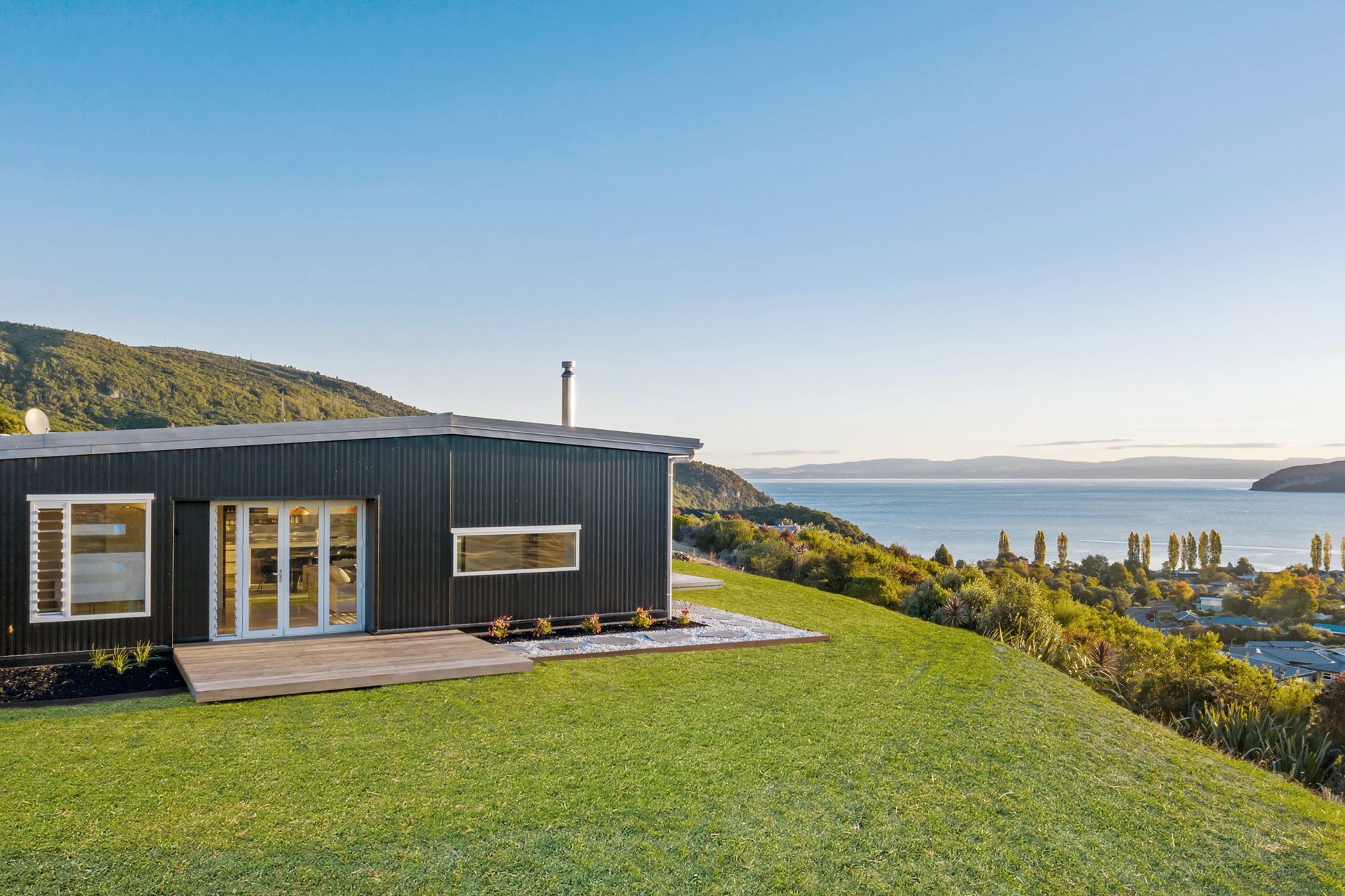 The opposite view is of Kinloch town and the sparkling waters of Lake Taupo. Photograph: ArchiPro.