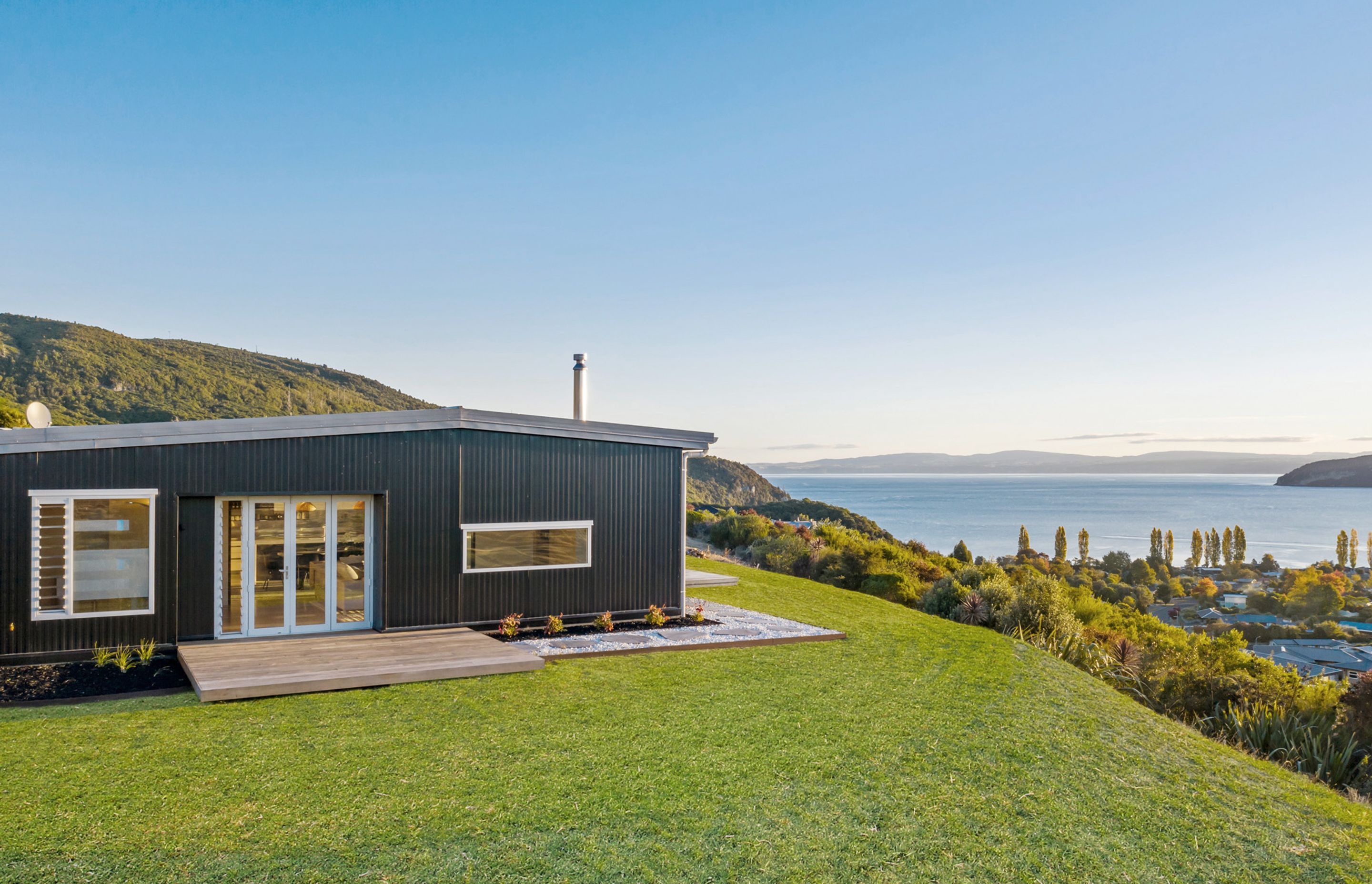 The opposite view is of Kinloch town and the sparkling waters of Lake Taupo. Photograph: ArchiPro.