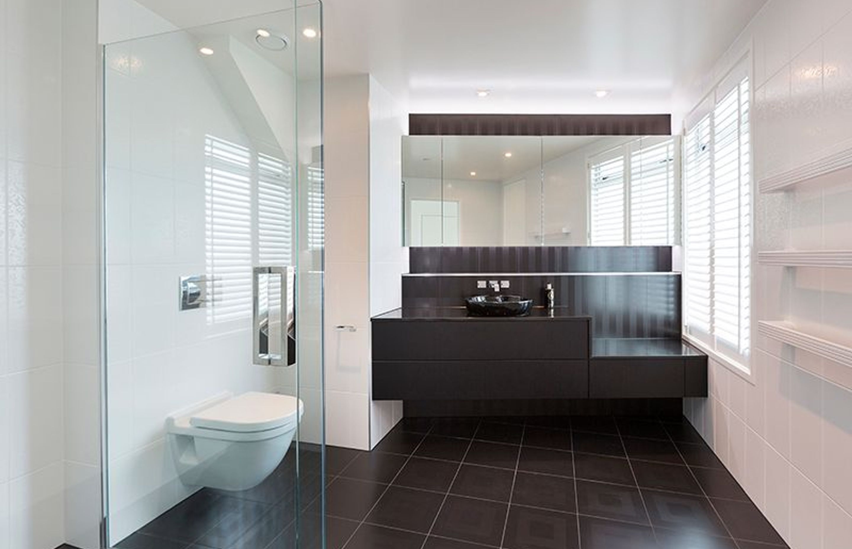 Master ensuite, custom vanity design to accommodate existing window position