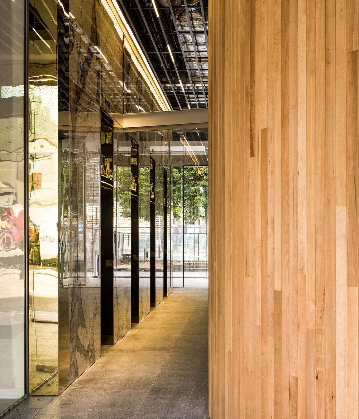 Curvaceous timber surfaces add texture and warmth against shiny surfaces.