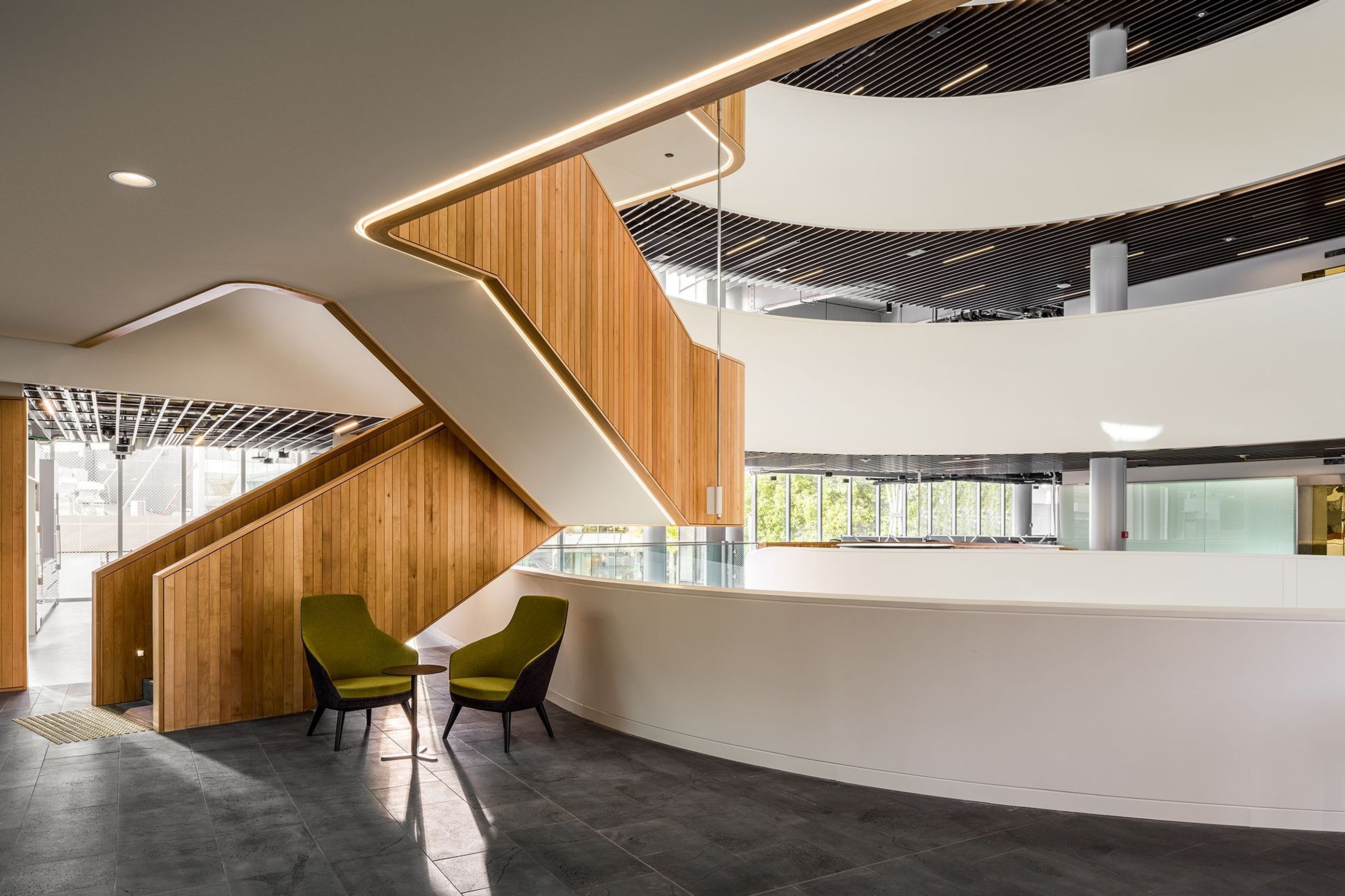 Despite the buildings size, its clever design maximises light into the deep interior of the building, including here under the staircase.