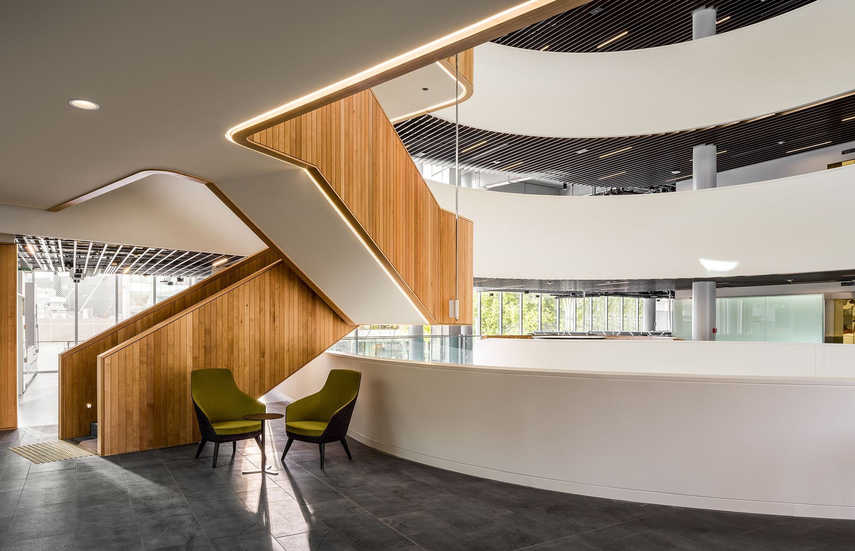 Despite the buildings size, its clever design maximises light into the deep interior of the building, including here under the staircase.