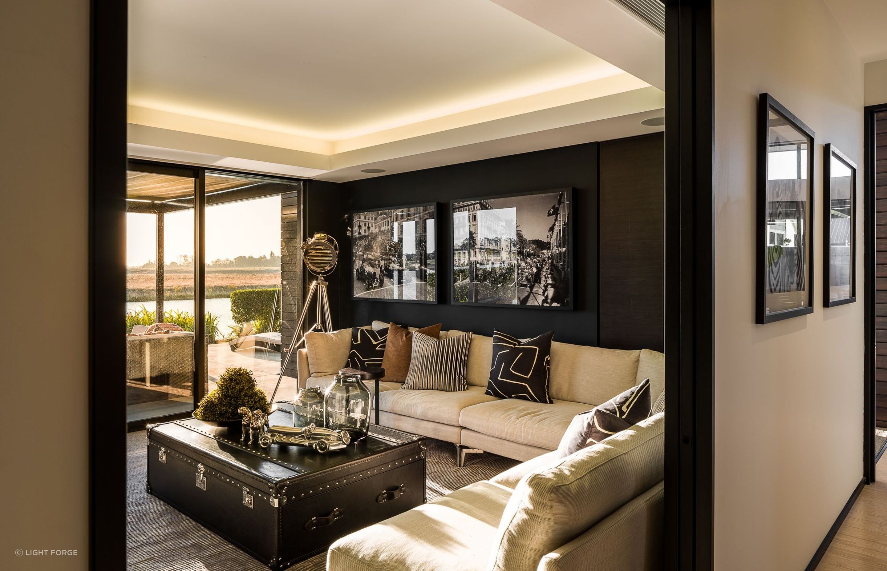 A media room is located directly opposite the front door in the linking element between the two pavilions.