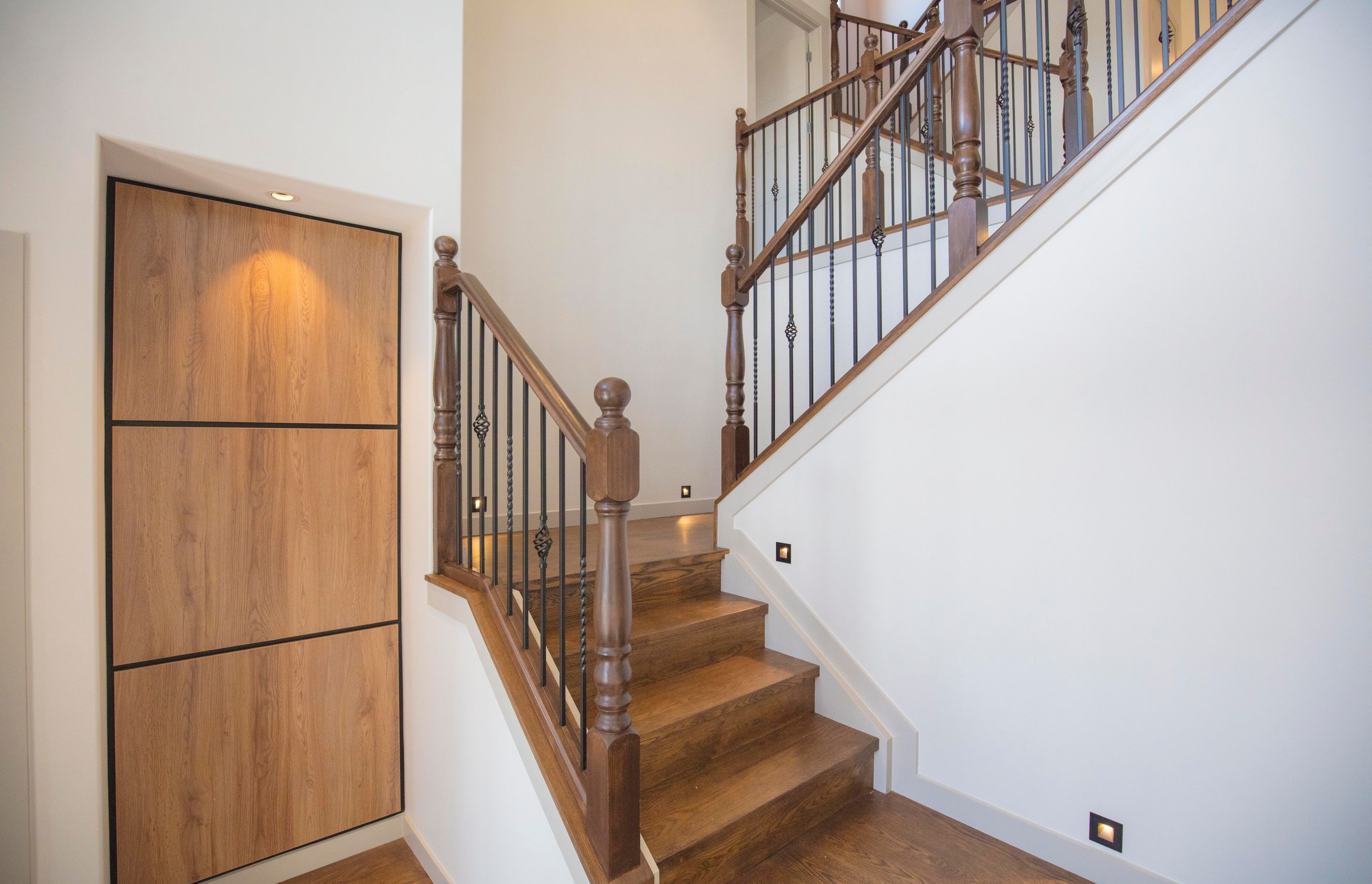 Lagonda Rise - Prime Grade Solid American White Oak in Herringbone Parquet w/ a two plank border and finished with a stain in 'Jacobean' and Waterborne Polyurethane