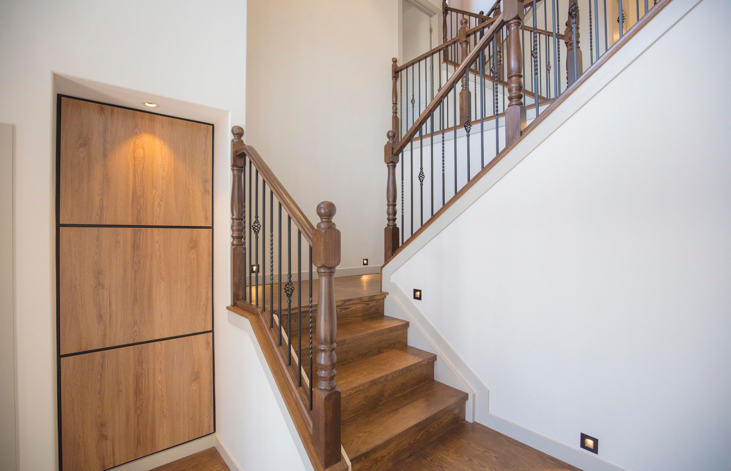 Lagonda Rise - Prime Grade Solid American White Oak in Herringbone Parquet w/ a two plank border and finished with a stain in 'Jacobean' and Waterborne Polyurethane