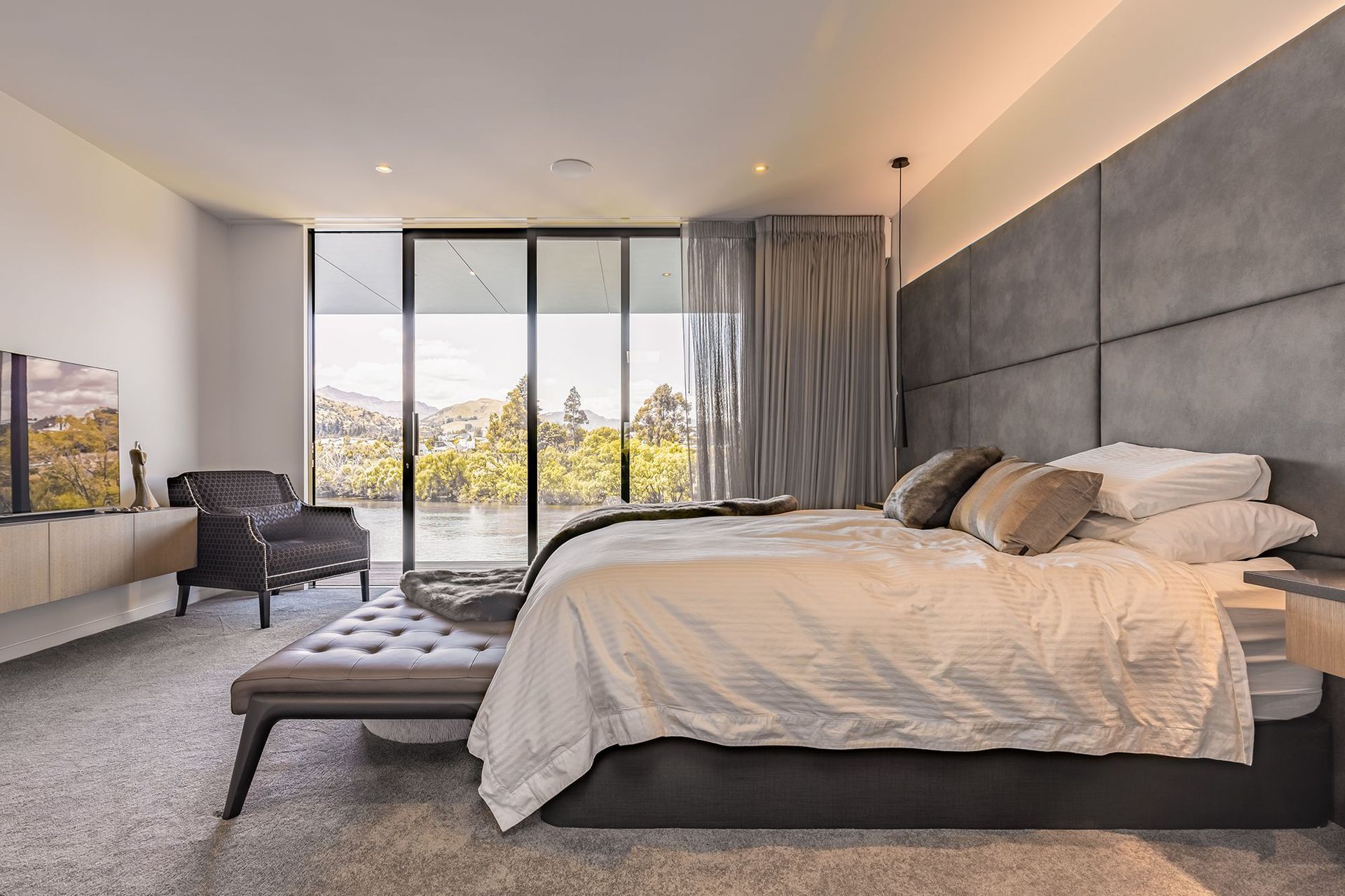 The bedroom enjoys a view right over the lake.