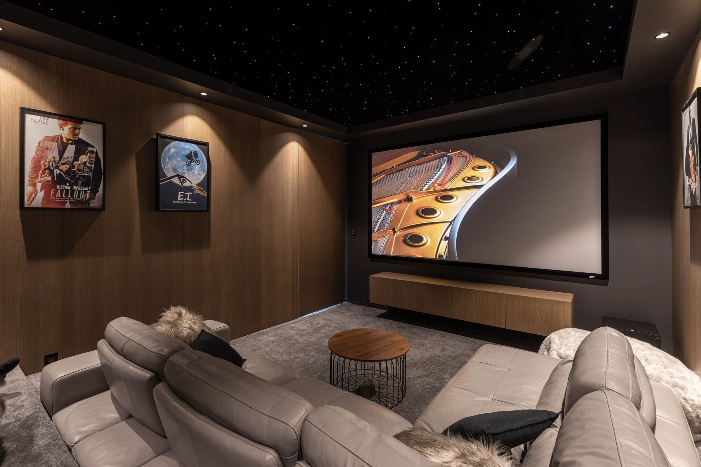 The site is very narrow so space at the back of the living area was perfectly suited to being a darker soundproofed environment for the home cinema, featuring a gorgeous starry ceiling.