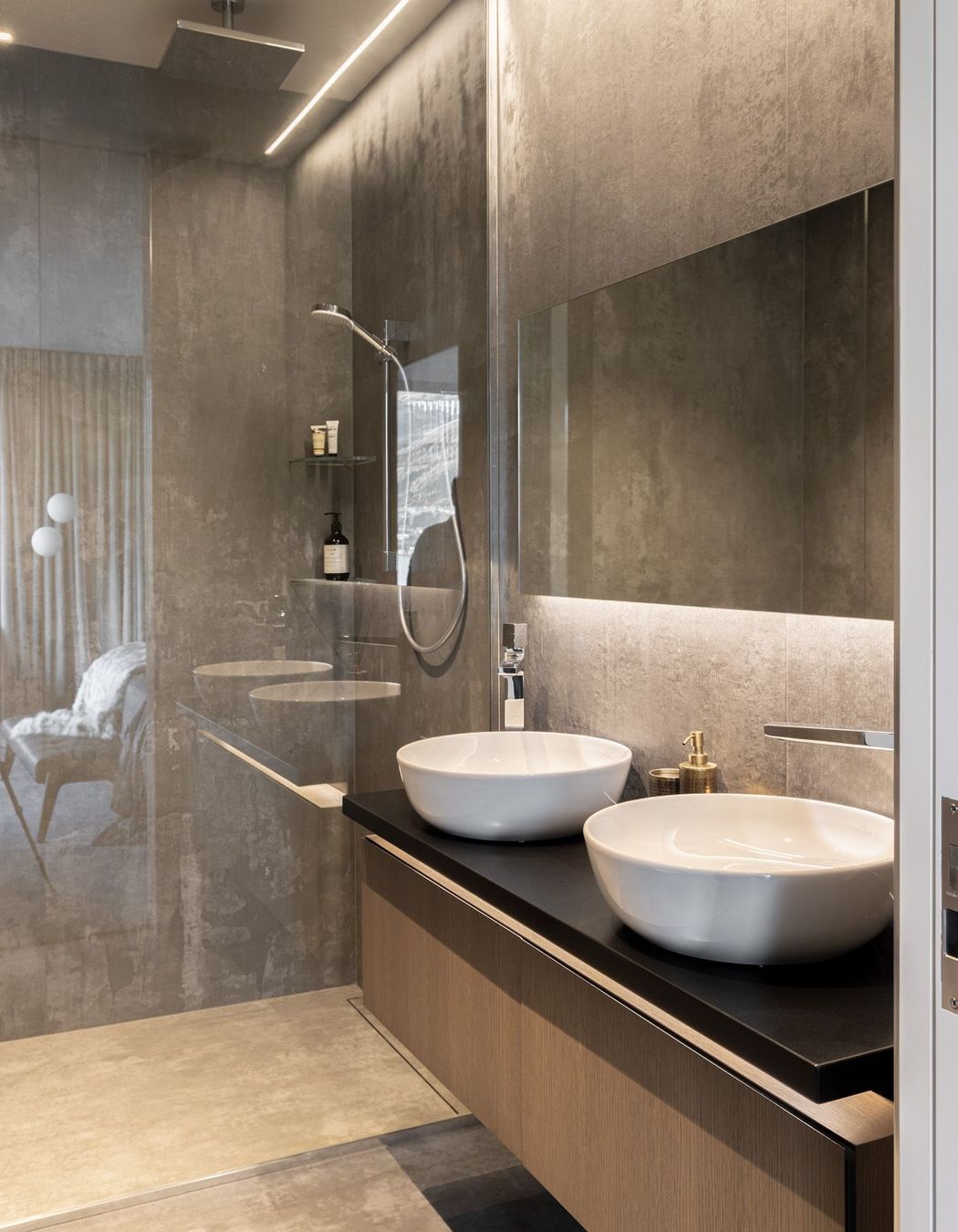 The shower and vanity in one of the bathrooms.