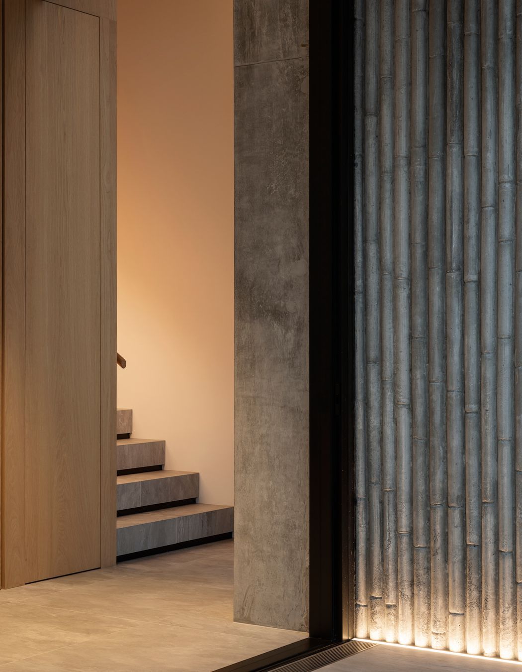 The stairwell leading upstairs from the front entrance.